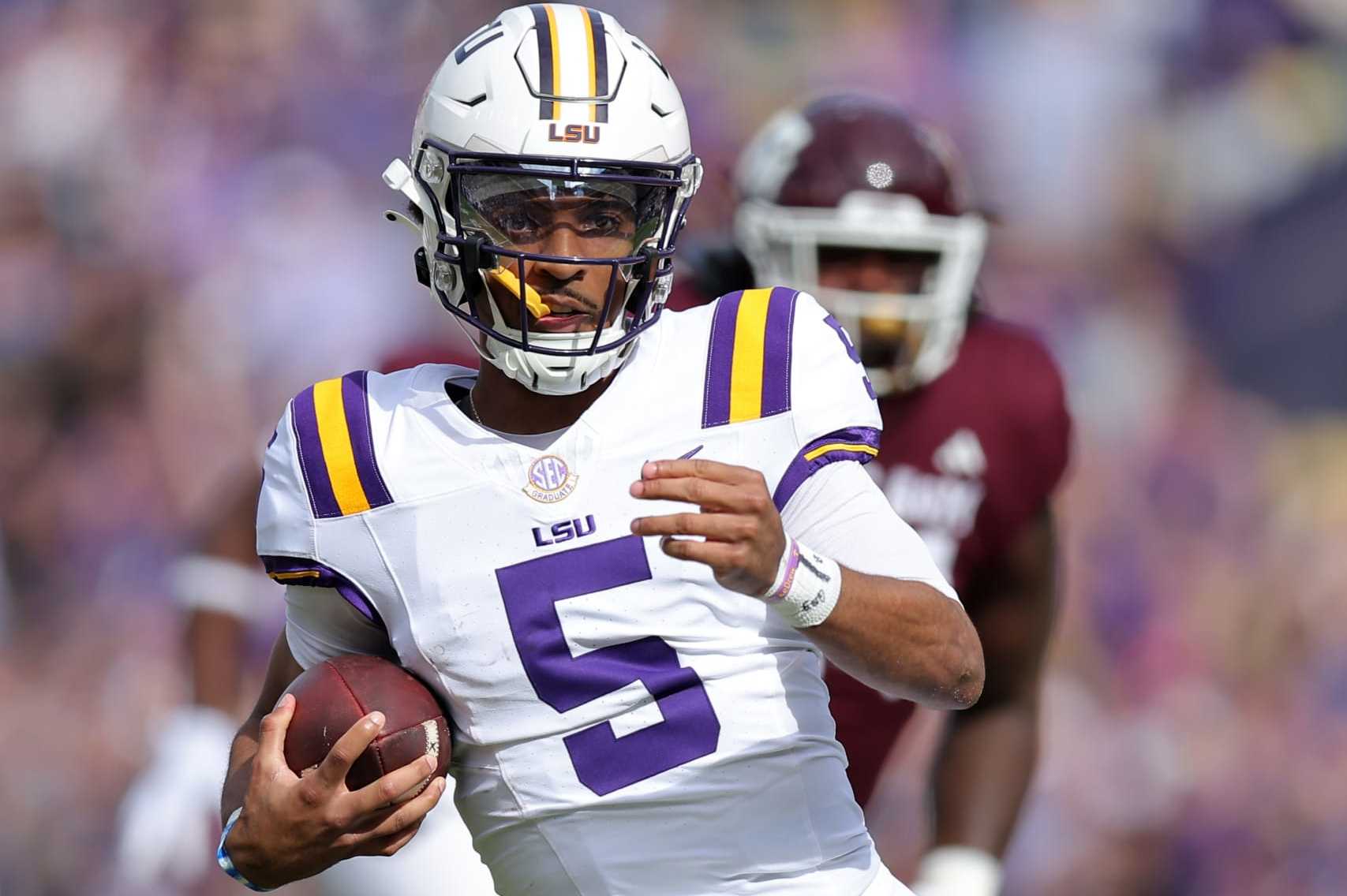BATON ROUGE, LOUISIANA - NOVEMBER 25: Jayden Daniels #5 of the LSU Tigers runs with the ball during the first half against the Texas A&M Aggies at Tiger Stadium on November 25, 2023 in Baton Rouge, Louisiana. (Photo by Jonathan Bachman/Getty Images)