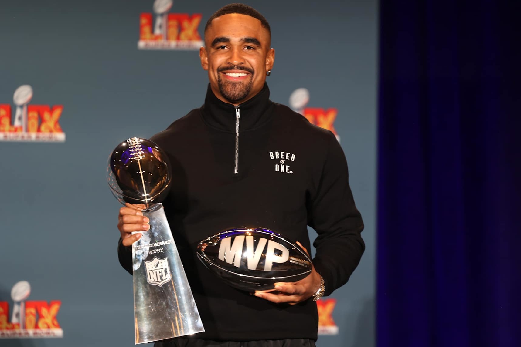 NEW ORLEANS, LOUISIANA - FEBRUARY 10:  Quarterback Jalen Hurts #1 of the Philadelphia Eagles, the MVP of Super Bowl LIX, holds both the MVP and Vince Lombardi trophies during a press conference at the Ernest N. Morial Convention Center on February 10, 2025 in New Orleans, Louisiana. The Eagles defeated the Kansas City Chiefs 40-22 in the Caesars Superdome on Sunday night. (Photo by Michael DeMocker/Getty Images)