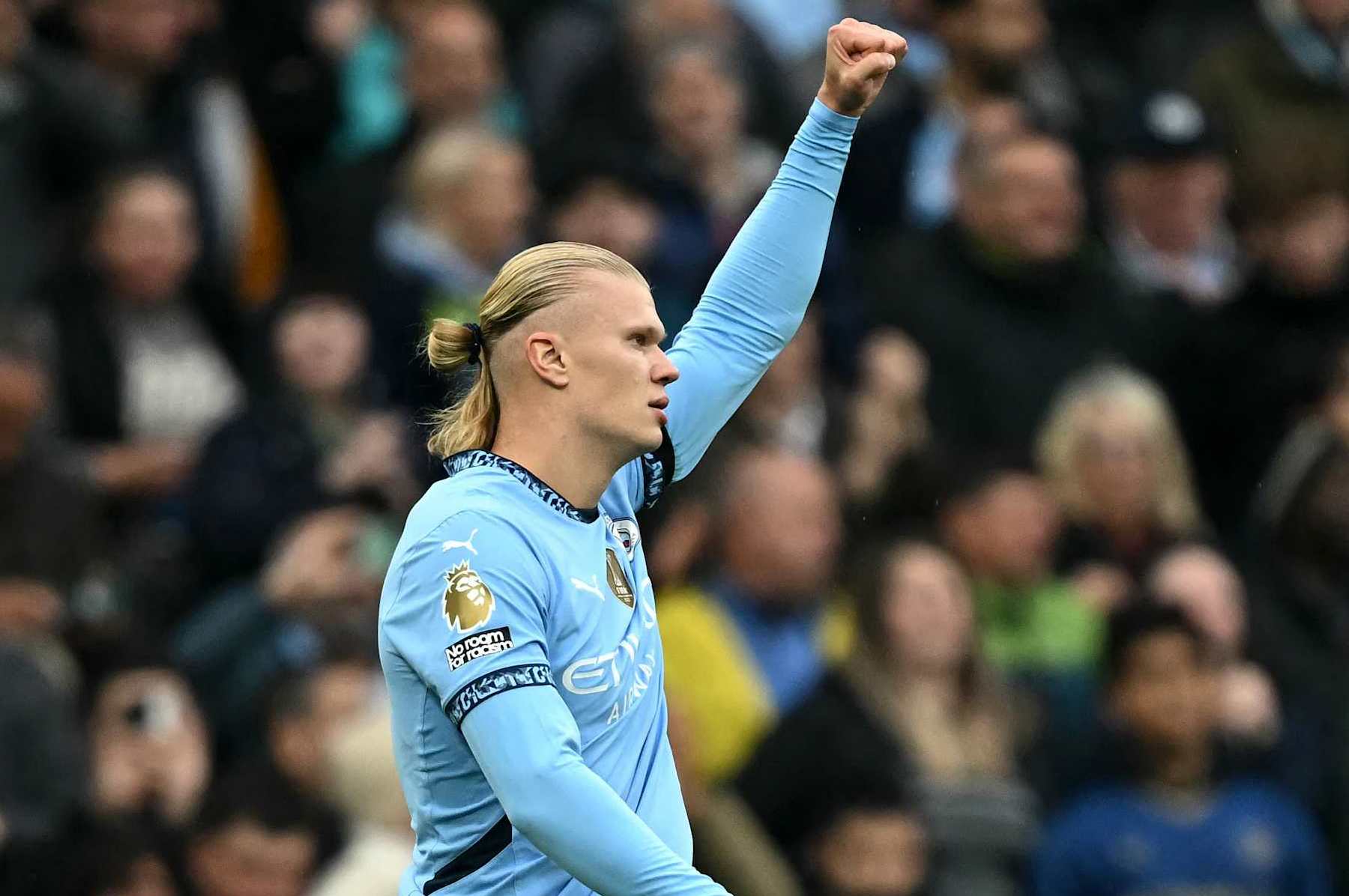 Manchester City's Norwegian striker #09 Erling Haaland celebrates scoring the team's first goal during the English Premier League football match between Manchester City and Arsenal at the Etihad Stadium in Manchester, north west England, on September 22, 2024. (Photo by Paul ELLIS / AFP) / RESTRICTED TO EDITORIAL USE. No use with unauthorized audio, video, data, fixture lists, club/league logos or 'live' services. Online in-match use limited to 120 images. An additional 40 images may be used in extra time. No video emulation. Social media in-match use limited to 120 images. An additional 40 images may be used in extra time. No use in betting publications, games or single club/league/player publications. /  (Photo by PAUL ELLIS/AFP via Getty Images)