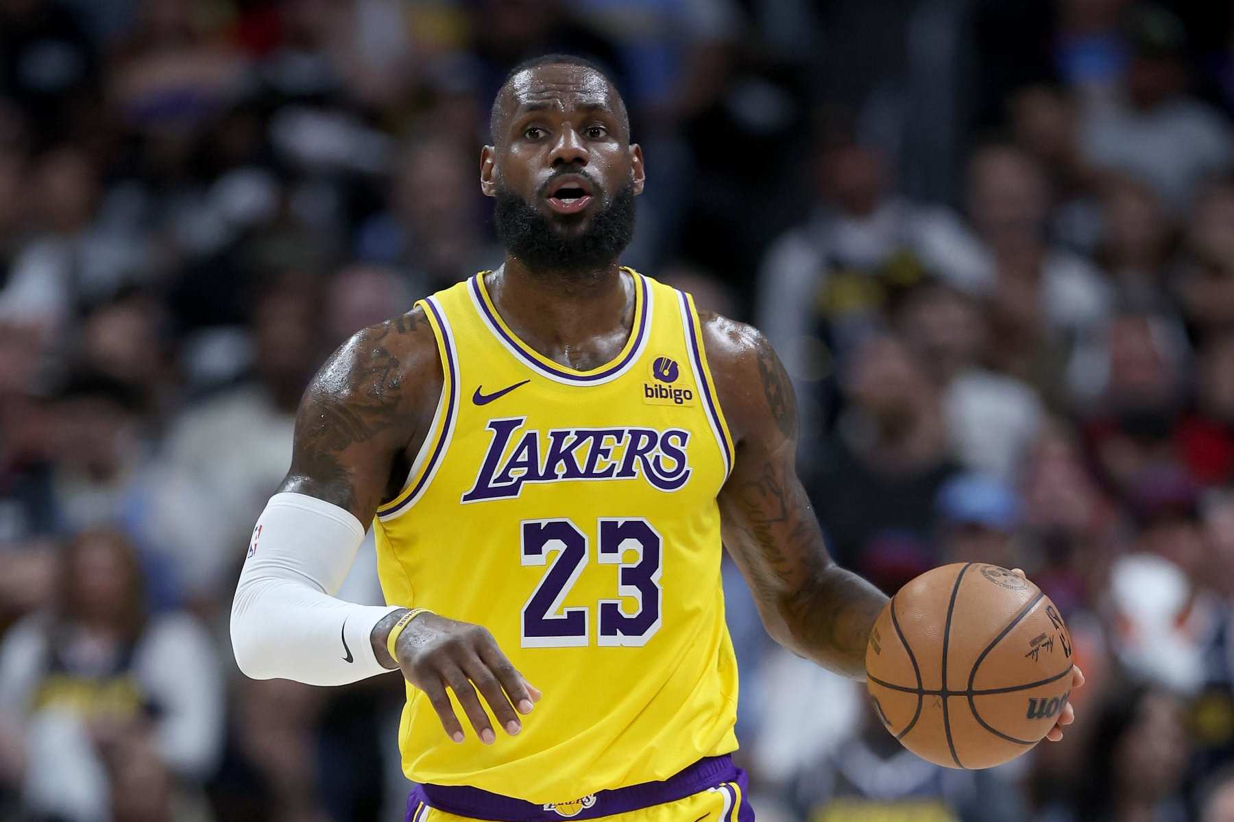 DENVER, COLORADO - APRIL 29: LeBron James #23 of the Los Angeles Lakers brings the ball down the court against the Denver Nuggets in the third quarter during game five of the Western Conference First Round Playoffs at Ball Arena on April 29, 2024 in Denver, Colorado. NOTE TO USER: User expressly acknowledges and agrees that, by downloading and or using this photograph, User is consenting to the terms and conditions of the Getty Images License Agreement. (Photo by Matthew Stockman/Getty Images)