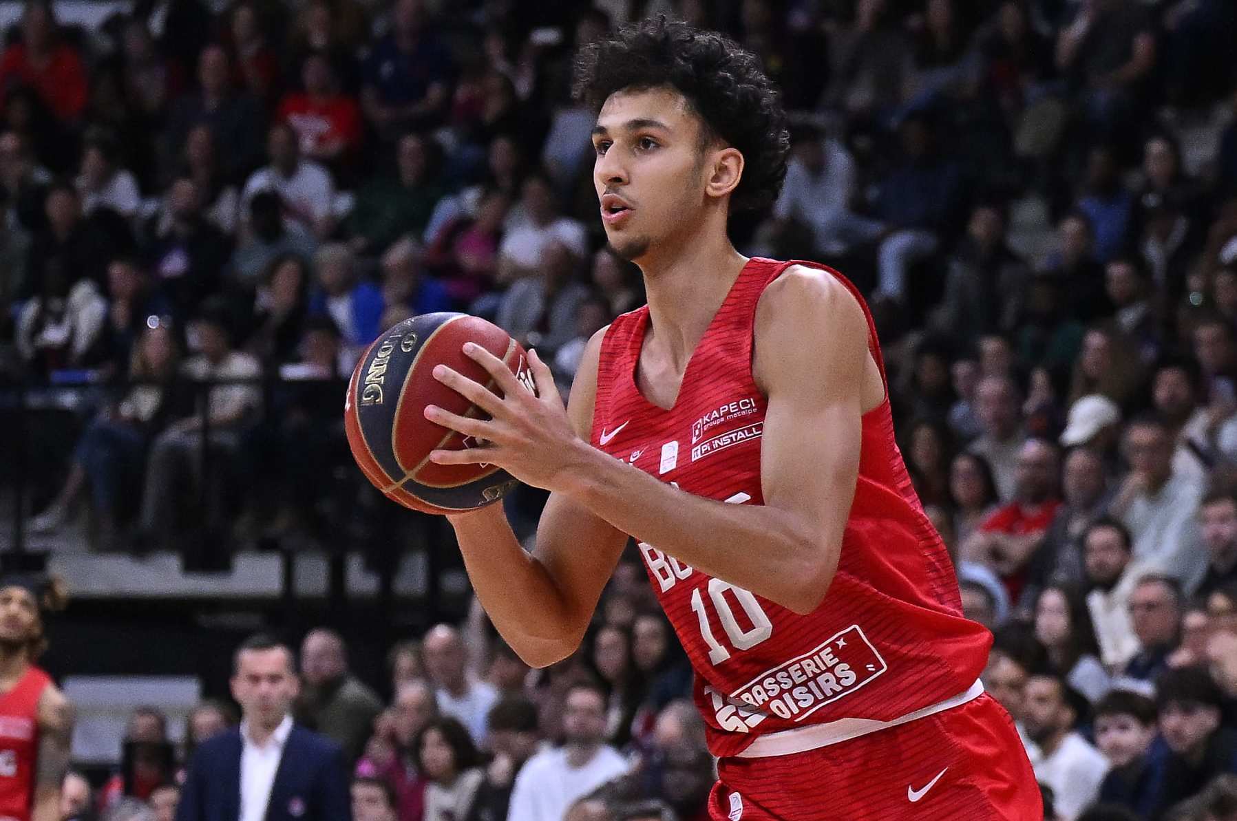 PARIS, FRANCE - APRIL 28: Zaccharie Risacher of Bourg en Bresse Basket runs with the ball during the Betclic Elite match between Paris and Bourg en Bresse Basket at Adidas Arena on April 28, 2024 in Paris, France. (Photo by Aurelien Meunier/Getty Images)