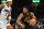 CLEVELAND, OHIO - DECEMBER 06: Donovan Mitchell #45 of the Cleveland Cavaliers drives to the basket around Paolo Banchero #5 of the Orlando Magic during the fourth quarter at Rocket Mortgage Fieldhouse on December 06, 2023 in Cleveland, Ohio. The Cavaliers defeated the Magic 121-111. NOTE TO USER: User expressly acknowledges and agrees that, by downloading and or using this photograph, User is consenting to the terms and conditions of the Getty Images License Agreement. (Photo by Jason Miller/Getty Images)