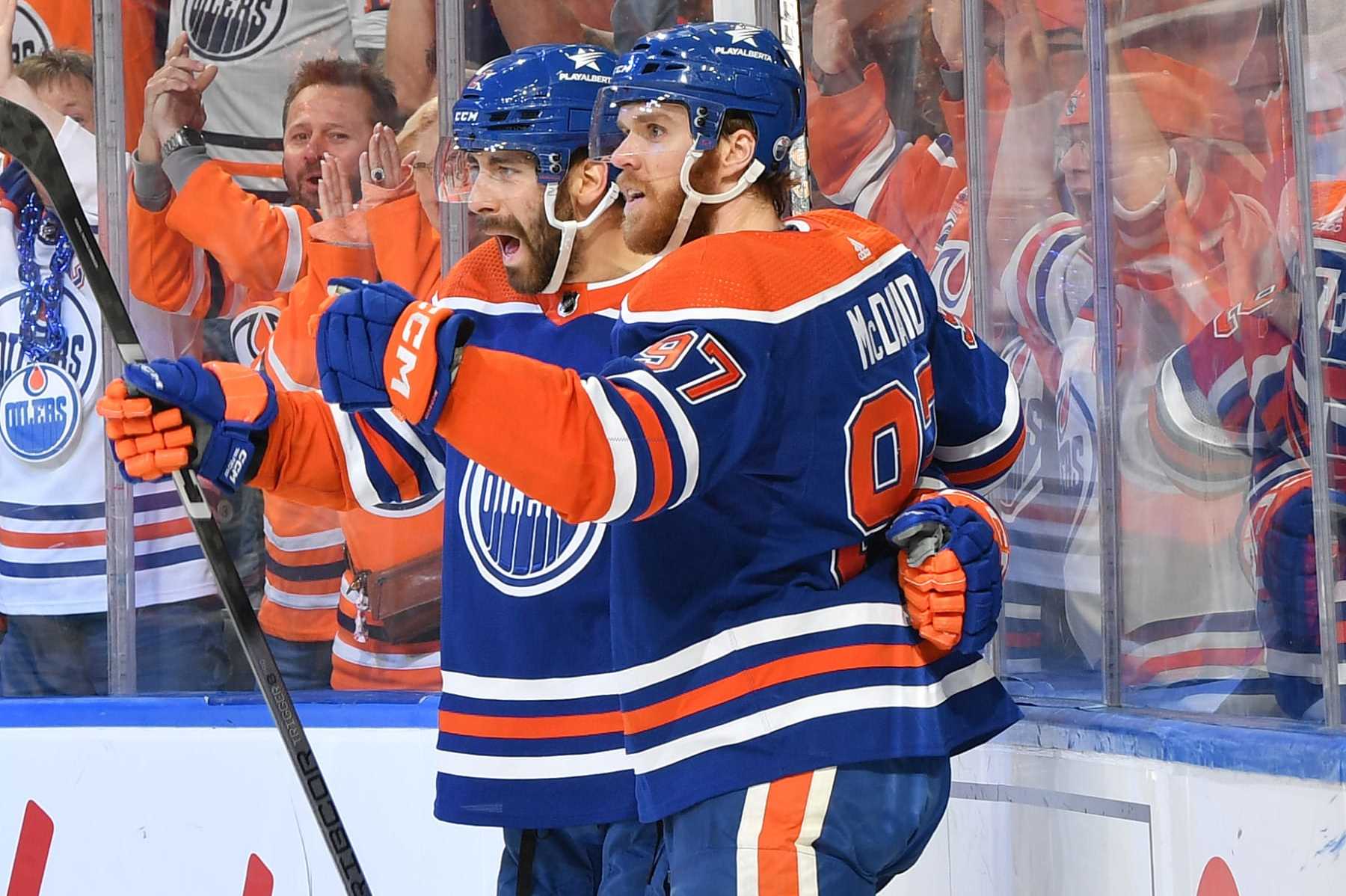 EDMONTON, CANADA - MAY 29: Evan Bouchard #2 of the Edmonton Oilers celebrates his first-period goal against the Dallas Stars with teammate Connor McDavid #97 in Game Four of the Western Conference Final of the 2024 Stanley Cup Playoffs at Rogers Place on May 29, 2024, in Edmonton, Alberta, Canada. (Photo by Andy Devlin/NHLI via Getty Images)
