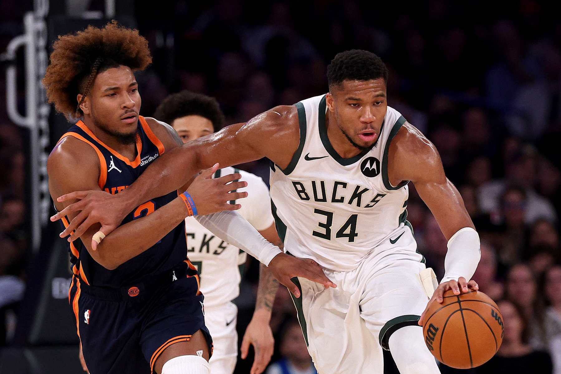 NEW YORK, NEW YORK - NOVEMBER 08:  Giannis Antetokounmpo #34 of the Milwaukee Bucks heads down court as Miles McBride #2 of the New York Knicks defends in the first half at Madison Square Garden on November 08, 2024 in New York City. NOTE TO USER: User expressly acknowledges and agrees that, by downloading and or using this photograph, User is consenting to the terms and conditions of the Getty Images License Agreement. (Photo by Elsa/Getty Images)