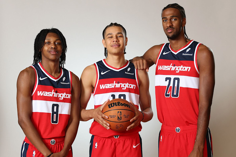 LAS VEGAS, NEVADA - JULY 17: (L-R) Carlton Carrington #17 of the Washington Wizards, Kyshawn George #18 of the Washington Wizards and Alexandre Sarr #12 of the Washington Wizards pose for a portrait during the 2024 NBA Rookie Photo Shoot at UNLV on July 17, 2024 in Las Vegas, Nevada. (Photo by Monica Schipper/Getty Images)