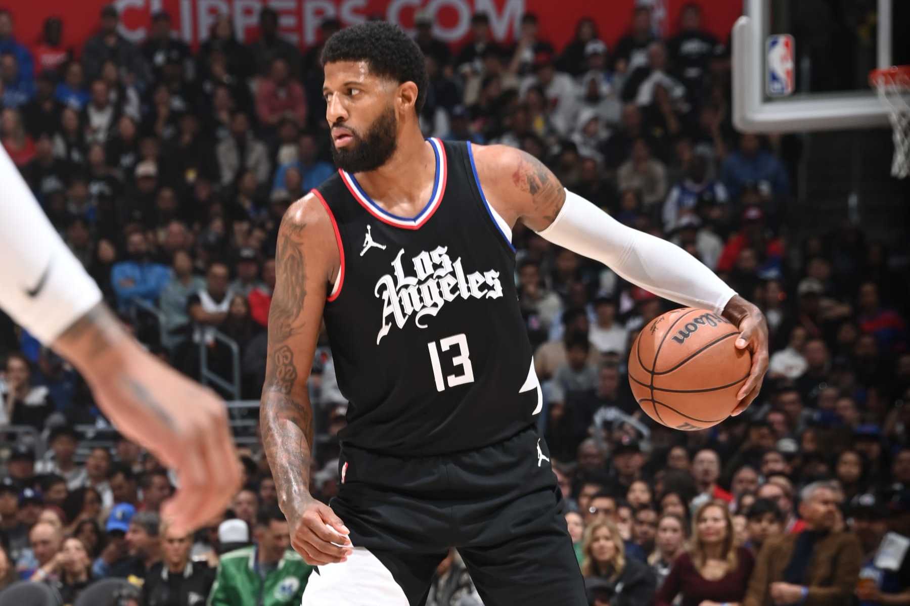 LOS ANGELES, CA - APRIL 23: Paul George #13 of the LA Clippers dribbles the ball during the game against the Dallas Mavericks during Round 1 Game 2 of the 2024 NBA Playoffs on April 23, 2024 at Crypto.Com Arena in Los Angeles, California. NOTE TO USER: User expressly acknowledges and agrees that, by downloading and/or using this Photograph, user is consenting to the terms and conditions of the Getty Images License Agreement. Mandatory Copyright Notice: Copyright 2024 NBAE (Photo by Andrew D. Bernstein/NBAE via Getty Images)