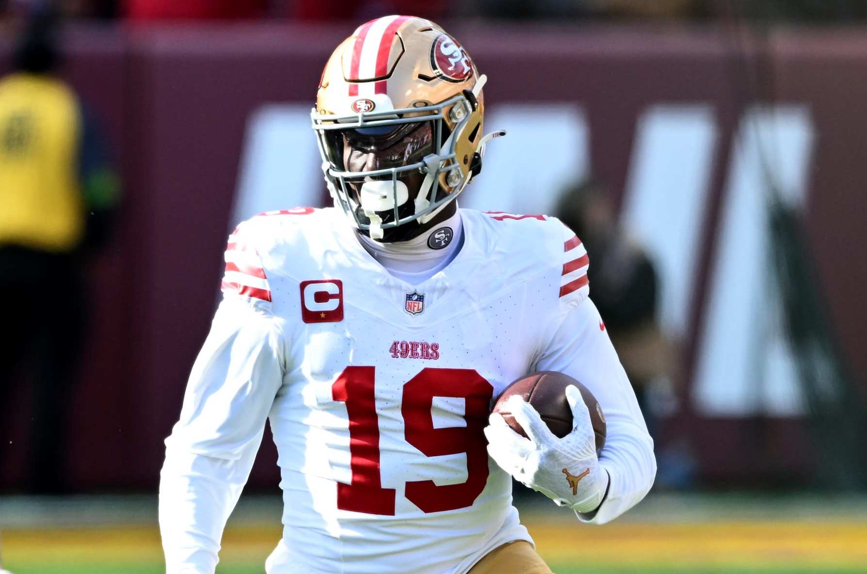 LANDOVER, MARYLAND - DECEMBER 31: Deebo Samuel #19 of the San Francisco 49ers runs with the ball against the Washington Commanders at FedExField on December 31, 2023 in Landover, Maryland. (Photo by G Fiume/Getty Images)