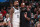 MILWAUKEE, WI - OCTOBER 26: Jacque Vaughn and Kyrie Irving #11 of the Brooklyn Nets talk against the Milwaukee Bucks on October 26, 2022 at the Fiserv Forum in Milwaukee, Wisconsin. NOTE TO USER: User expressly acknowledges and agrees that, by downloading and or using this Photograph, user is consenting to the terms and conditions of the Getty Images License Agreement. Mandatory Copyright Notice: Copyright 2022 NBAE (Photo by Nathaniel S. Butler/NBAE via Getty Images).