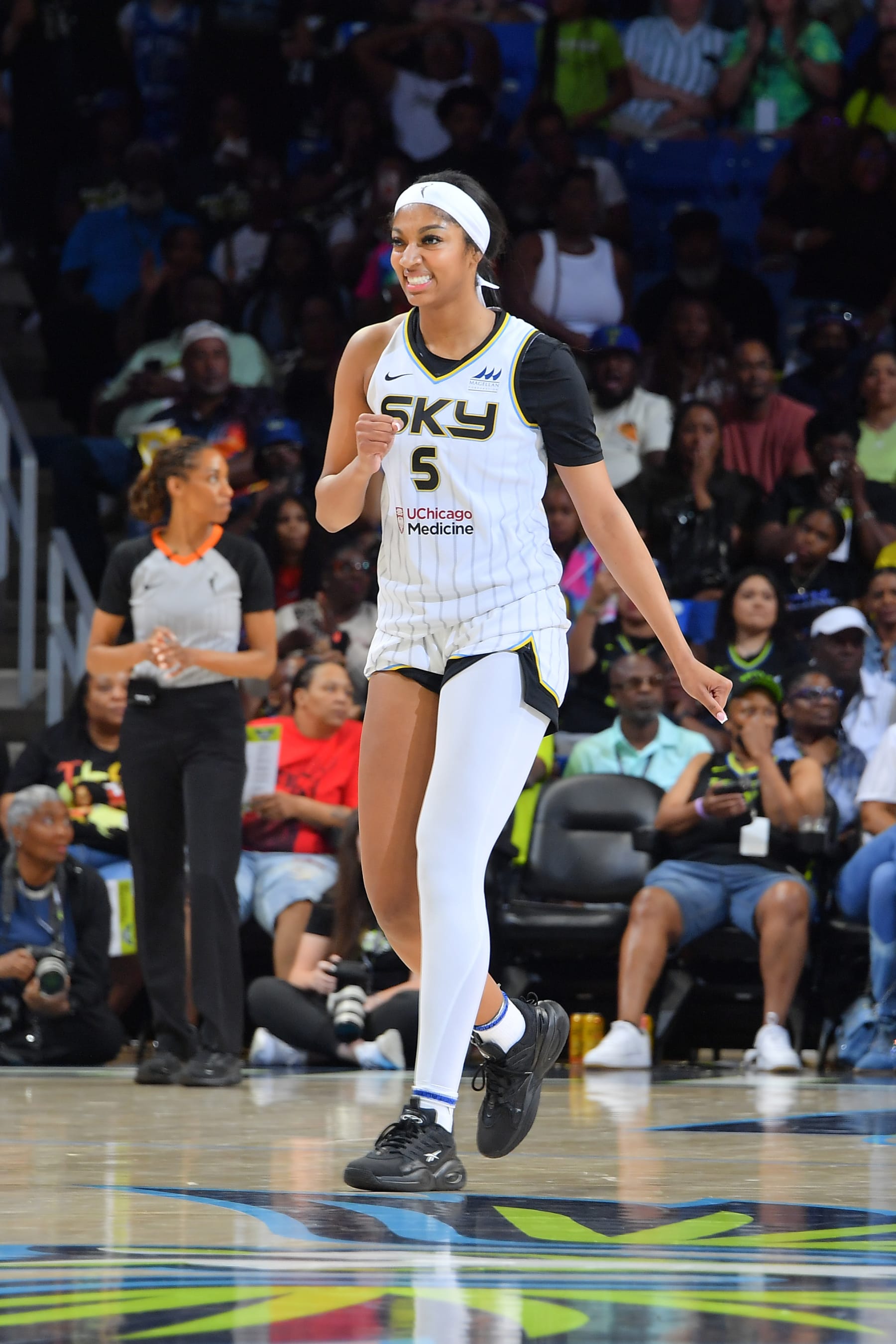 ARLINGTON, TX -  MAY 18: Angel Reese #5 of the Chicago Sky looks on during the game against the Dallas Wings on May 18, 2024 at the College Park Center in Arlington, TX. NOTE TO USER: User expressly acknowledges and agrees that, by downloading and or using this photograph, User is consenting to the terms and conditions of the Getty Images License Agreement. Mandatory Copyright Notice: Copyright 2024 NBAE (Photo by Michael Gonzales/NBAE via Getty Images)