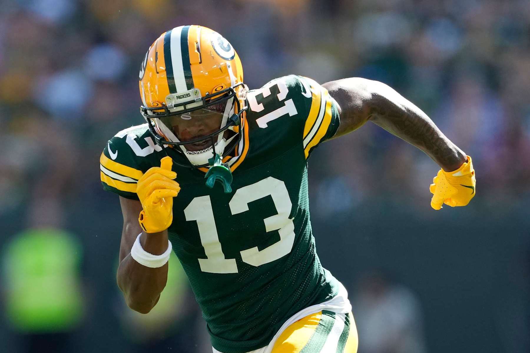 GREEN BAY, WISCONSIN - SEPTEMBER 29: Dontayvion Wicks #13 of the Green Bay Packers in action against the Minnesota Vikings in the first half at Lambeau Field on September 29, 2024 in Green Bay, Wisconsin. (Photo by Patrick McDermott/Getty Images)
