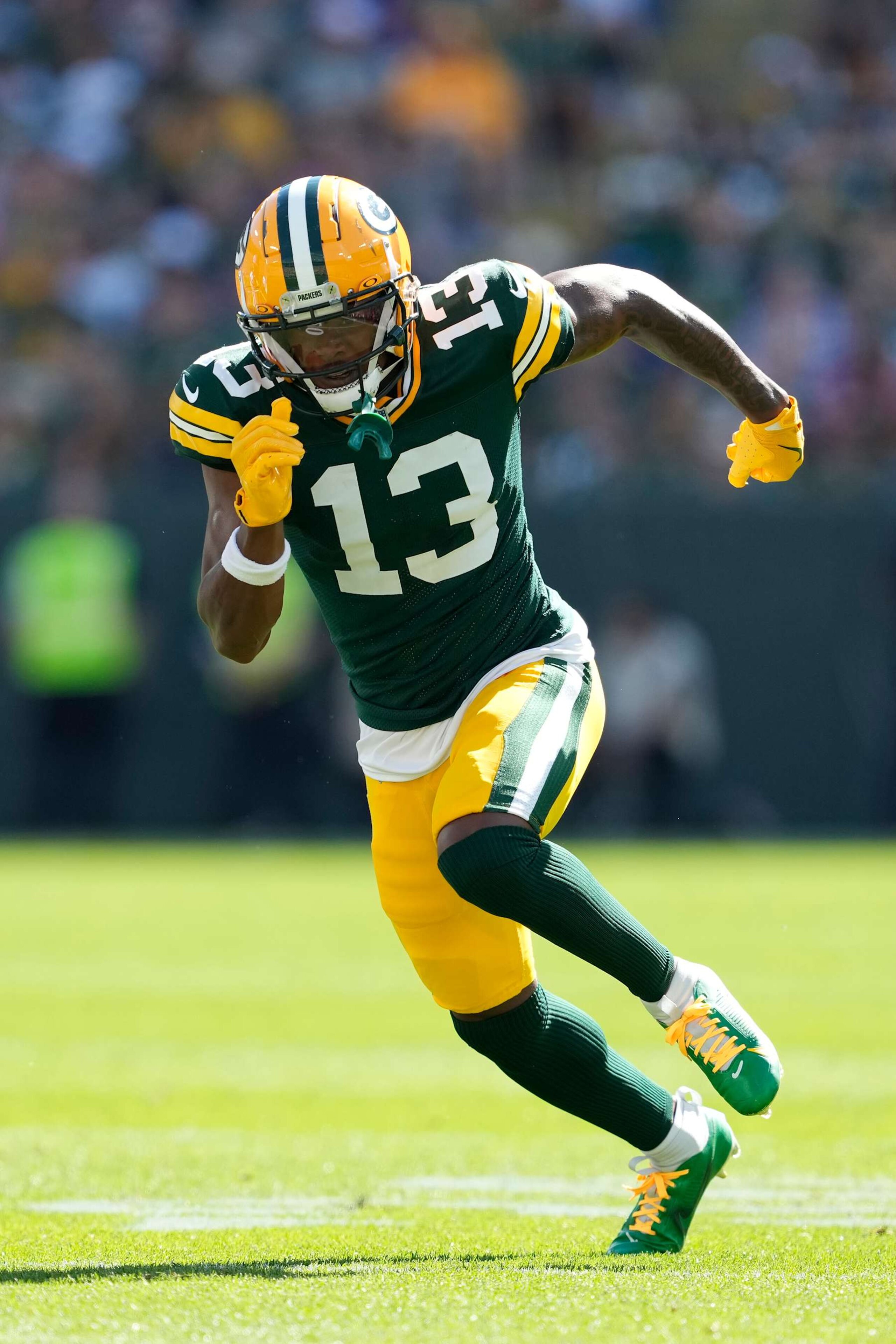 GREEN BAY, WISCONSIN - SEPTEMBER 29: Dontayvion Wicks #13 of the Green Bay Packers in action against the Minnesota Vikings in the first half at Lambeau Field on September 29, 2024 in Green Bay, Wisconsin. (Photo by Patrick McDermott/Getty Images)