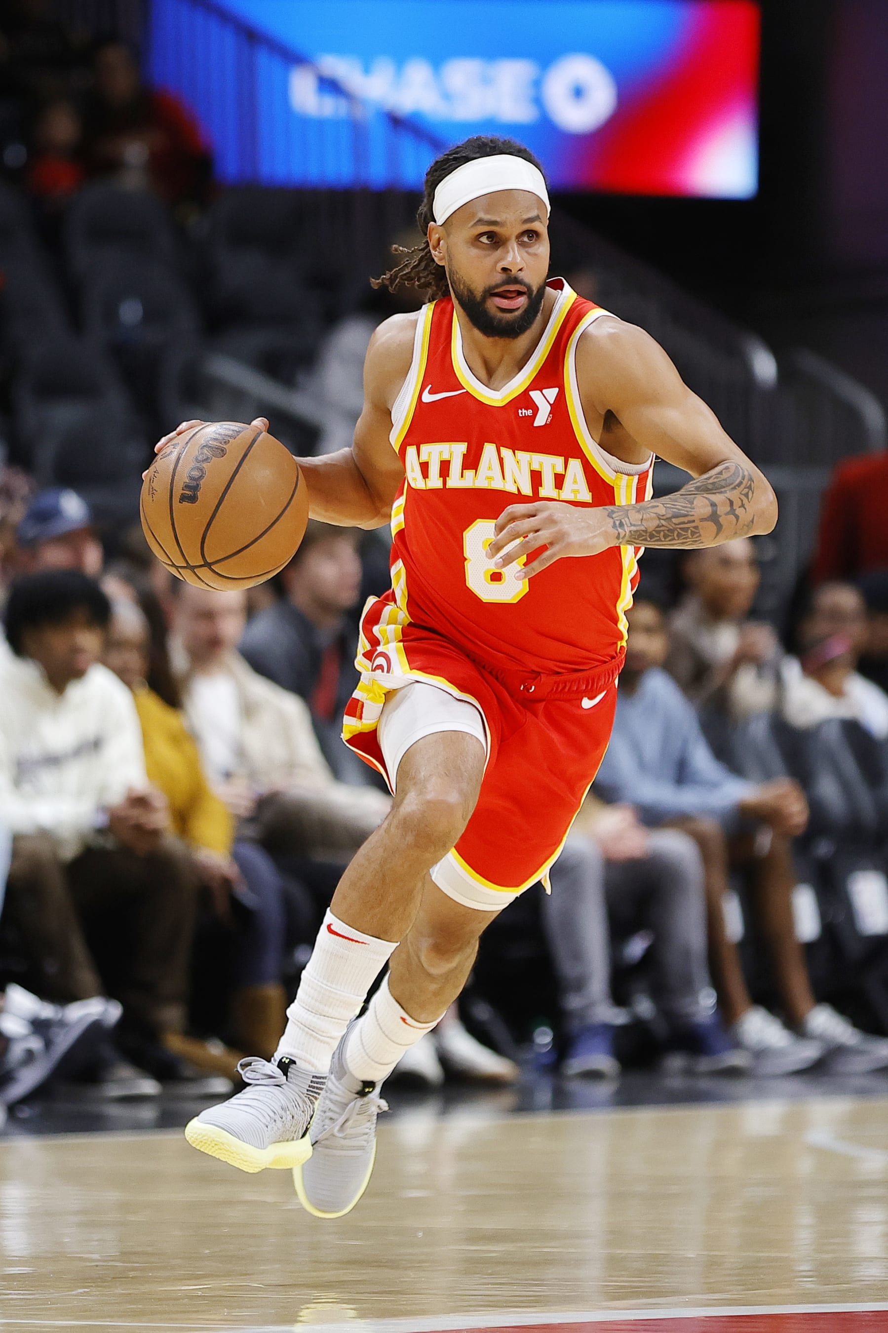ATLANTA, GEORGIA - JANUARY 28: Patty Mills #8 of the Atlanta Hawks drives against the Toronto Raptors during the first half at State Farm Arena on January 28, 2024 in Atlanta, Georgia. NOTE TO USER: User expressly acknowledges and agrees that, by downloading and or using this photograph, User is consenting to the terms and conditions of the Getty Images License Agreement. (Photo by Alex Slitz/Getty Images)