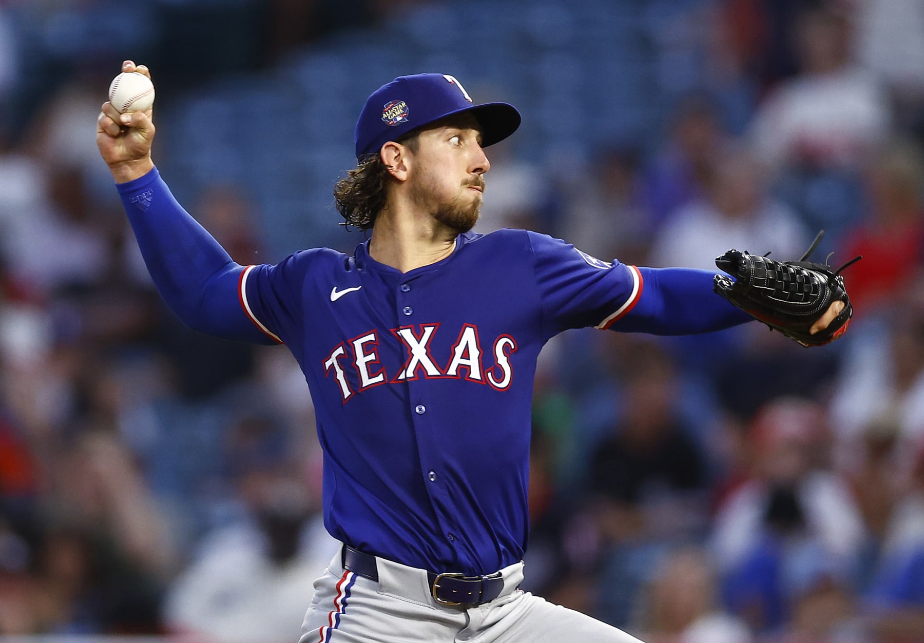 ANAHEIM, CALIFORNIA - JULY 10:  Michael Lorenzen #23 of the Texas Rangers throws against the Los Angeles Angels within the fifth inning at Angel Stadium of Anaheim on July 10, 2024 in Anaheim, California. (Characterize by Ronald Martinez/Getty Photos)