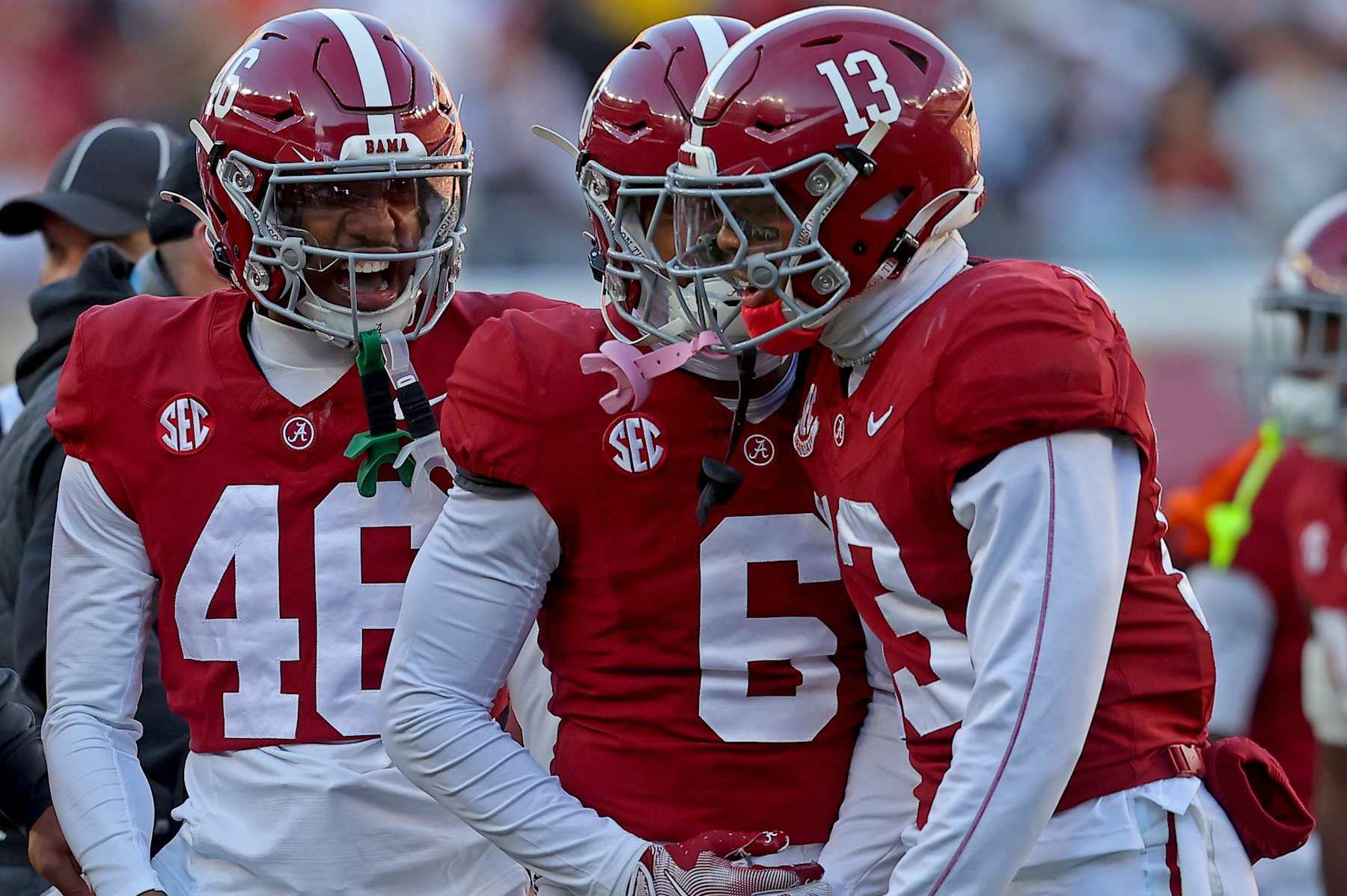 TUSCALOOSA, ALABAMA - NOVEMBER 30: Malachi Moore #13 of the Alabama Crimson Tide celebrates with teammates Chase Davis #46 and Kameron Howard #6 during the first half at Bryant-Denny Stadium on November 30, 2024 in Tuscaloosa, Alabama. (Photo by Jason Clark/Getty Images)