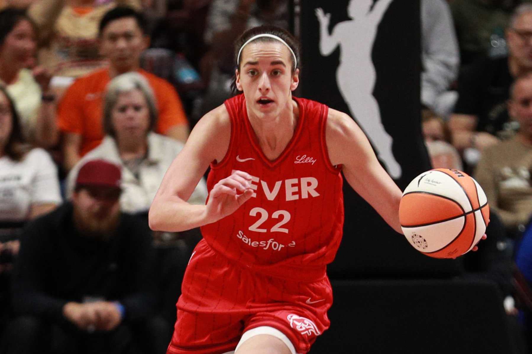 UNCASVILLE, CT - SEPTEMBER 25: Caitlin Clark #22 of the Indiana Fever dribbles the ball during the game against the Connecticut Sun during Round 1 Game 2 of the 2024 WNBA Playoffs on Septmember 25, 2024 at the Mohegan Sun Arena in Uncasville, Connecticut. NOTE TO USER: User expressly acknowledges and agrees that, by downloading and or using this photograph, User is consenting to the terms and conditions of the Getty Images License Agreement. Mandatory Copyright Notice: Copyright 2024 NBAE (Photo by Chris Marion/NBAE via Getty Images)