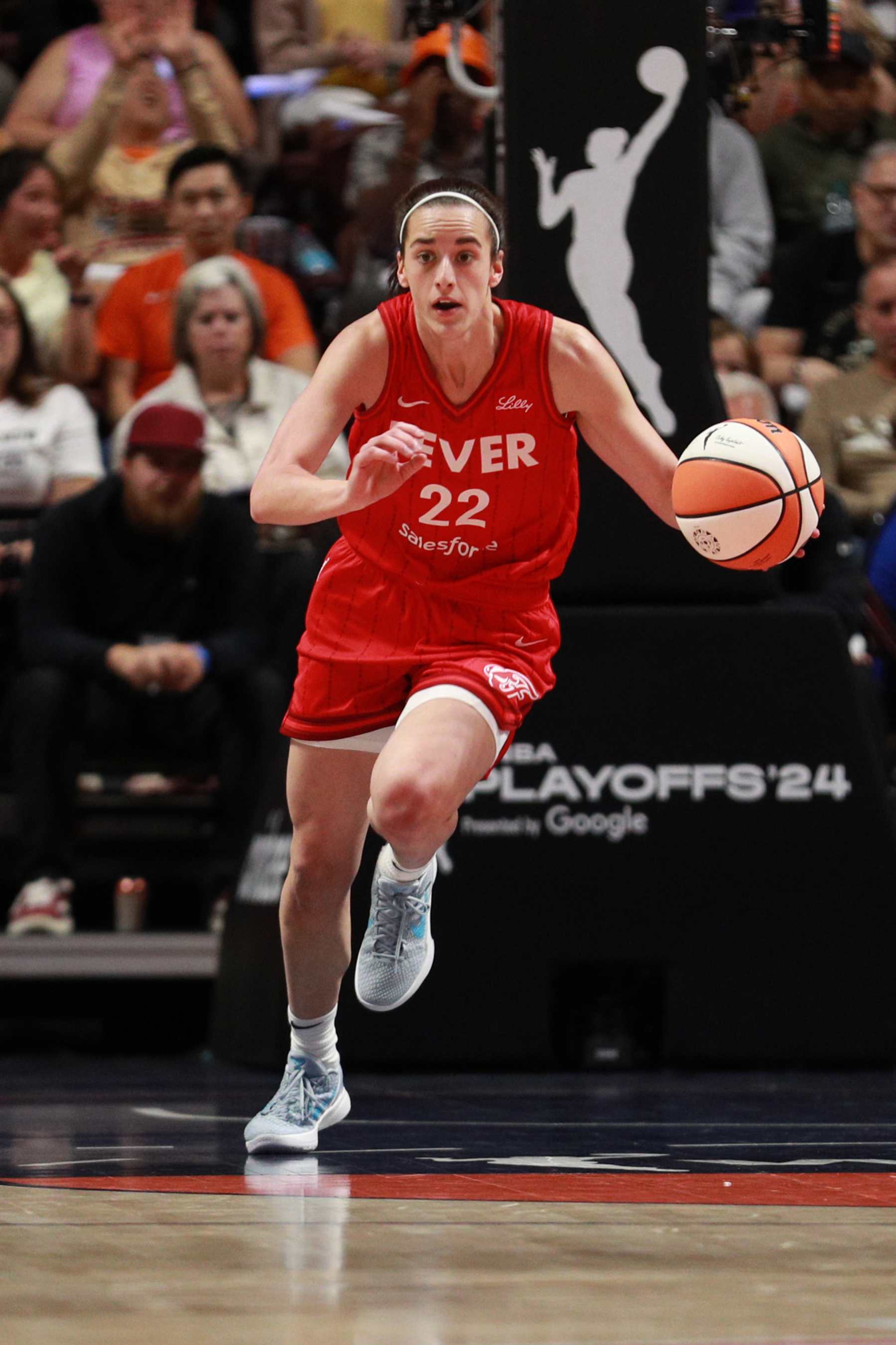 UNCASVILLE, CT - SEPTEMBER 25: Caitlin Clark #22 of the Indiana Fever dribbles the ball during the game against the Connecticut Sun during Round 1 Game 2 of the 2024 WNBA Playoffs on Septmember 25, 2024 at the Mohegan Sun Arena in Uncasville, Connecticut. NOTE TO USER: User expressly acknowledges and agrees that, by downloading and or using this photograph, User is consenting to the terms and conditions of the Getty Images License Agreement. Mandatory Copyright Notice: Copyright 2024 NBAE (Photo by Chris Marion/NBAE via Getty Images)