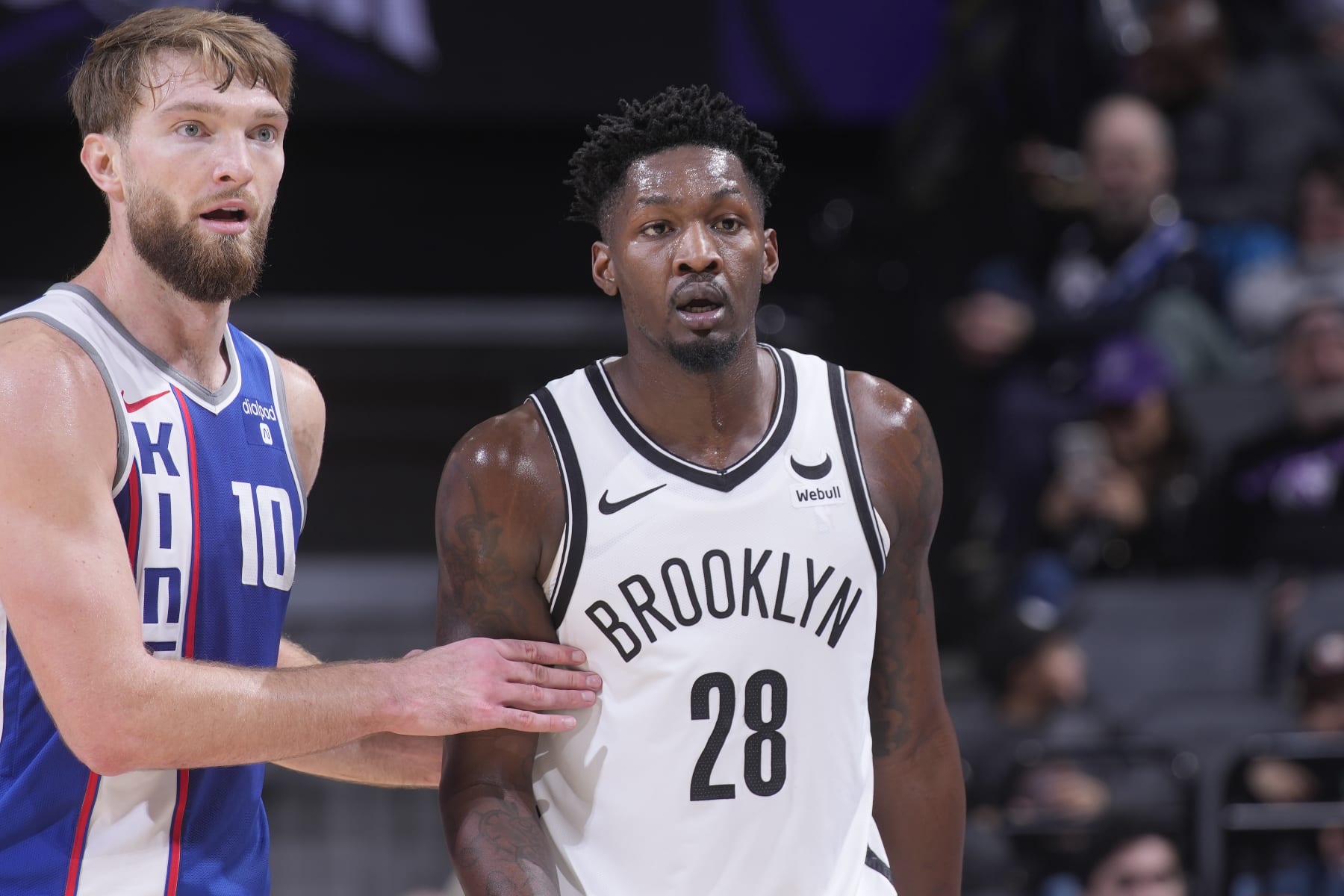 SACRAMENTO, CA - DECEMBER 11: Domantas Sabonis #10 of the Sacramento Kings and Dorian Finney-Smith #28 of the Brooklyn Nets look on during the game on December 11, 2023 at Golden 1 Center in Sacramento, California. NOTE TO USER: User expressly acknowledges and agrees that, by downloading and or using this photograph, User is consenting to the terms and conditions of the Getty Images Agreement. Mandatory Copyright Notice: Copyright 2023 NBAE (Photo by Rocky Widner/NBAE via Getty Images)