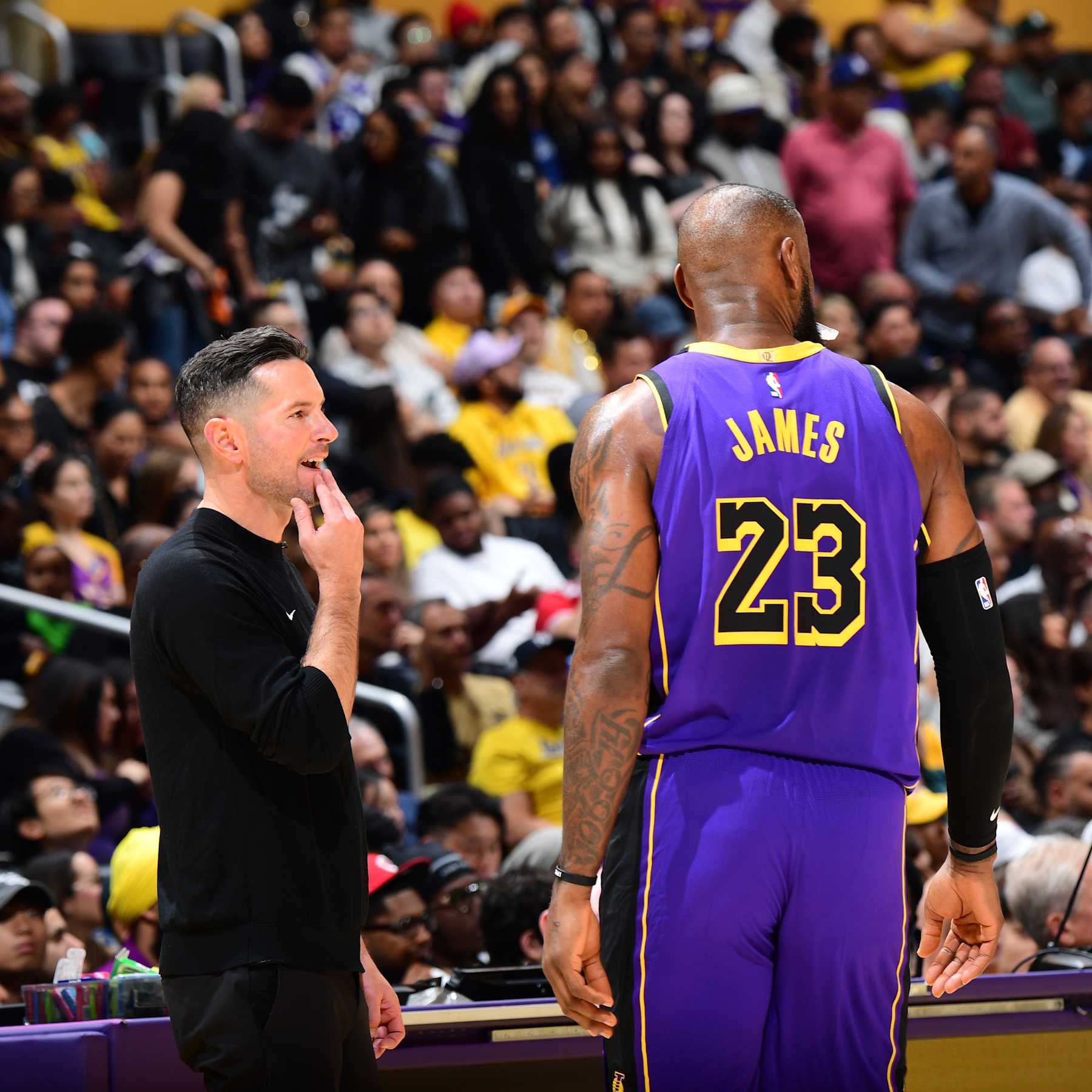 LOS ANGELES, CA - OCTOBER 25: LeBron James #23 and Head Coach JJ Redick of the Los Angeles Lakers talk during the game on October 25, 2024 at Crypto.Com Arena in Los Angeles, California. NOTE TO USER: User expressly acknowledges and agrees that, by downloading and/or using this Photograph, user is consenting to the terms and conditions of the Getty Images License Agreement. Mandatory Copyright Notice: Copyright 2024 NBAE (Photo by Adam Pantozzi/NBAE via Getty Images)
