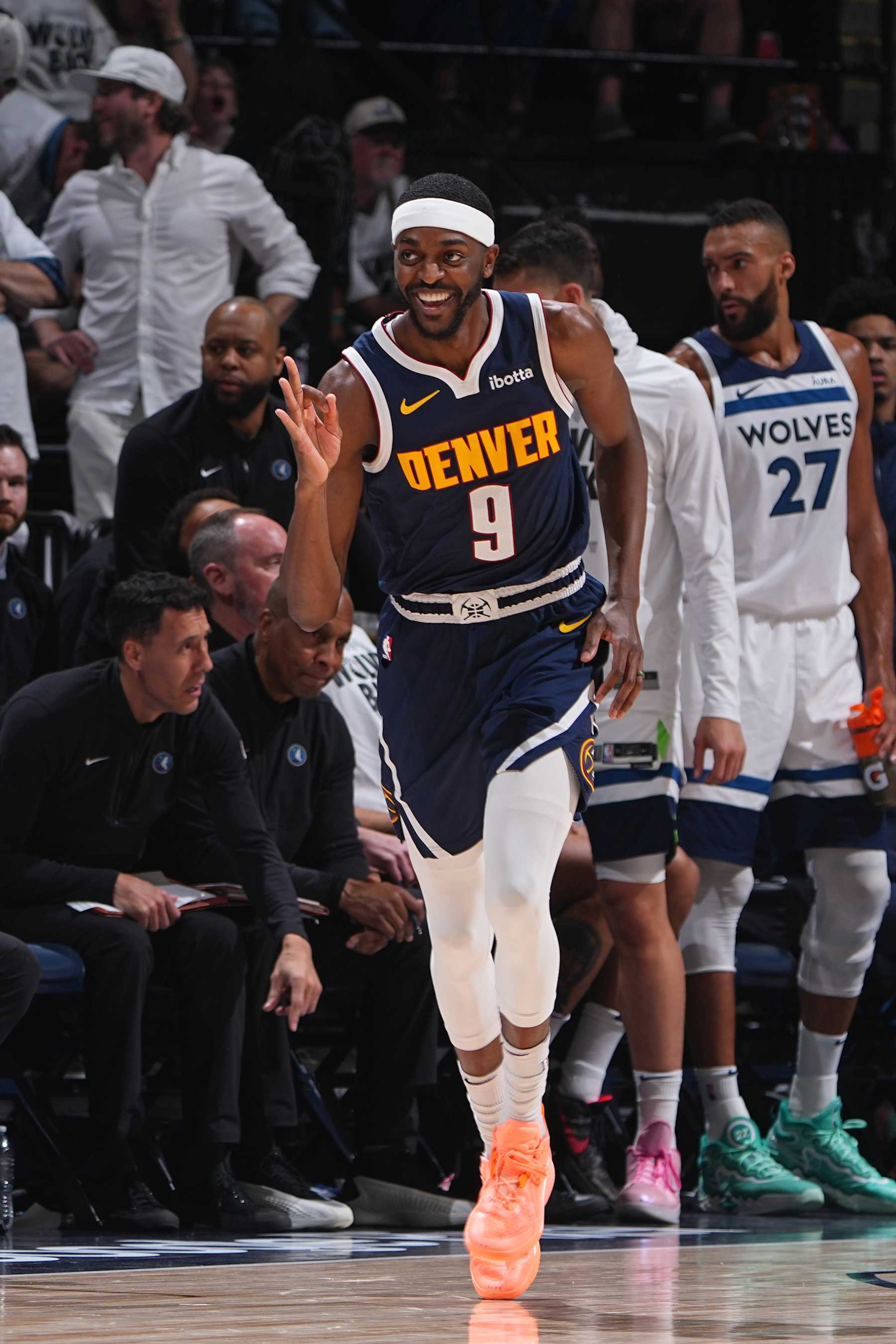 MINNEAPOLIS, MN - MAY 12: Justin Holiday #9 of the Denver Nuggets celebrates during the game against the Minnesota Timberwolves during Round 2 Game 4 of the 2024 NBA Playoffs on May 12, 2024 at Target Center in Minneapolis, Minnesota. NOTE TO USER: User expressly acknowledges and agrees that, by downloading and/or using this Photograph, user is consenting to the terms and conditions of the Getty Images License Agreement. Mandatory Copyright Notice: Copyright 2024 NBAE (Photo by Garrett Ellwood/NBAE via Getty Images) MINNEAPOLIS, MN - MAY 12: Justin Holiday #9 of the Denver Nuggets celebrates during the game against the Minnesota Timberwolves during Round 2 Game 4 of the 2024 NBA Playoffs on May 12, 2024 at Target Center in Minneapolis, Minnesota. NOTE TO USER: User expressly acknowledges and agrees that, by downloading and/or using this Photograph, user is consenting to the terms and conditions of the Getty Images License Agreement. Mandatory Copyright Notice: Copyright 2024 NBAE (Photo by Garrett Ellwood/NBAE via Getty Images)