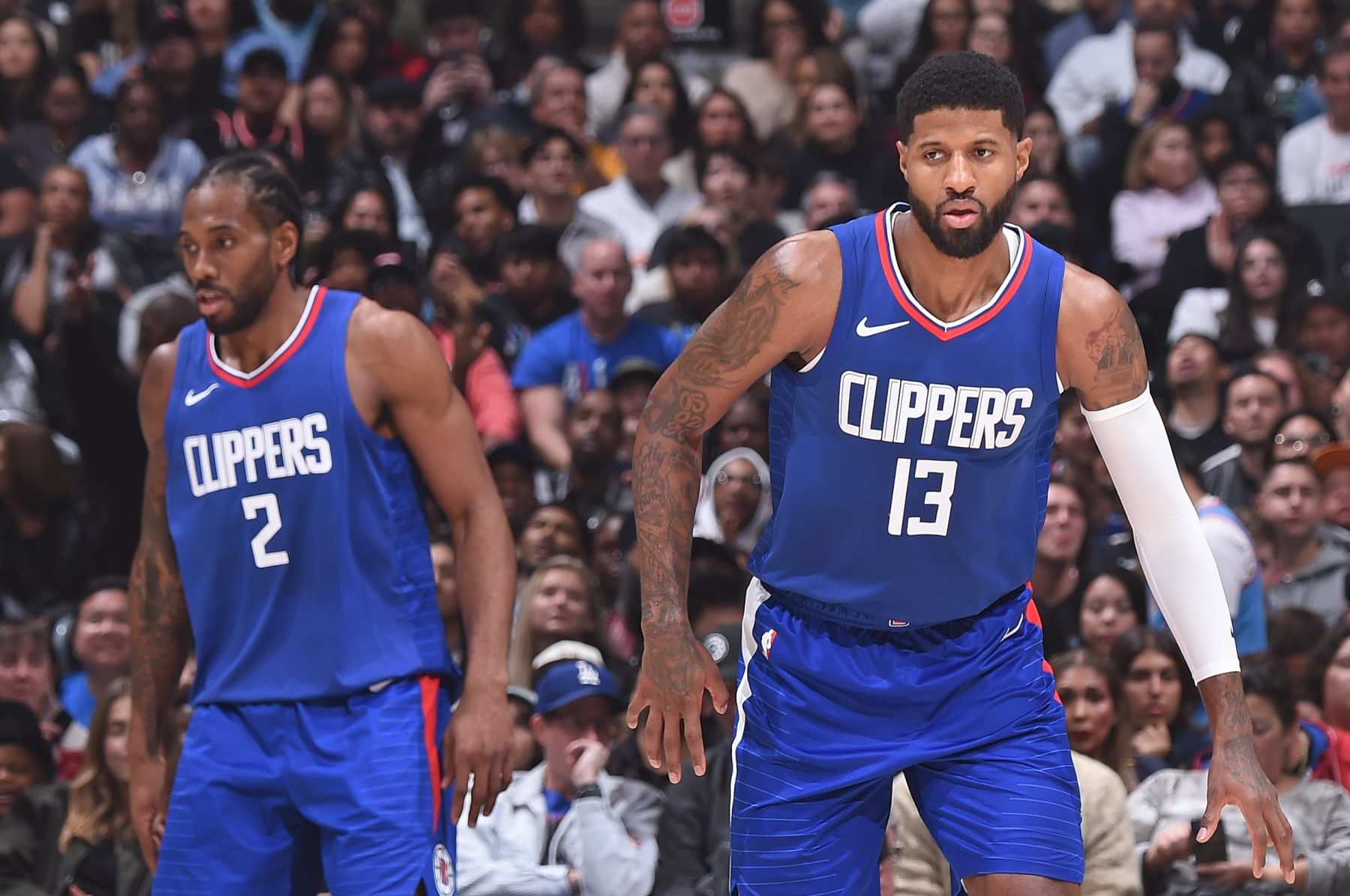 LOS ANGELES, CA - JANUARY 1: Paul George #13 and Kawhi Leonard #2 of the LA Clippers looks on during the game against the Miami Heat on January 1, 2024 at Crypto.Com Arena in Los Angeles, California. NOTE TO USER: User expressly acknowledges and agrees that, by downloading and/or using this Photograph, user is consenting to the terms and conditions of the Getty Images License Agreement. Mandatory Copyright Notice: Copyright 2024 NBAE (Photo by Juan Ocampo/NBAE via Getty Images)
