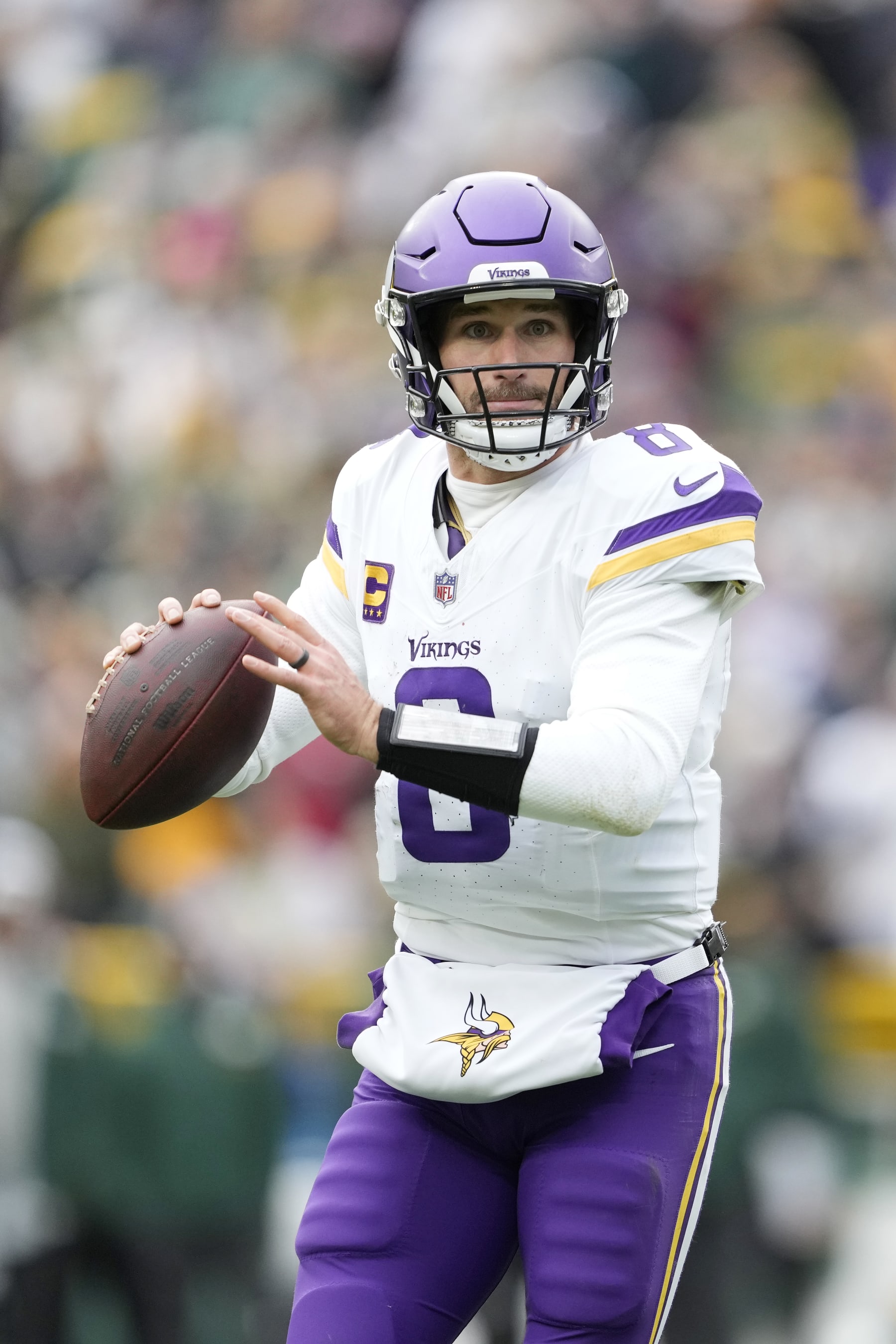 GREEN BAY, WISCONSIN - OCTOBER 29: Kirk Cousins #8 of the Minnesota Vikings looks to throw a pass against the Green Bay Packers in the second half at Lambeau Field on October 29, 2023 in Green Bay, Wisconsin. (Photo by Patrick McDermott/Getty Images)