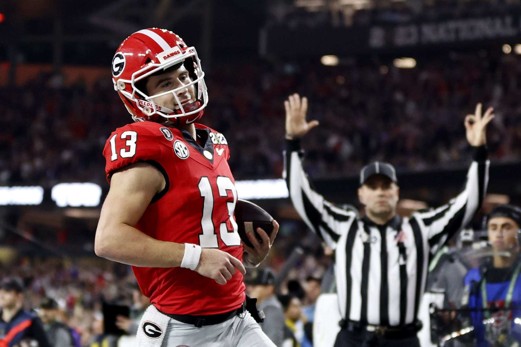 INGLEWOOD, CALIFORNIA - JANUARY 09: Stetson Bennett #13 of the Georgia Bulldogs runs for a touchdown in the second quarter against the TCU Horned Frogs in the College Football Playoff National Championship game at SoFi Stadium on January 09, 2023 in Inglewood, California. (Photo by Steph Chambers/Getty Images)