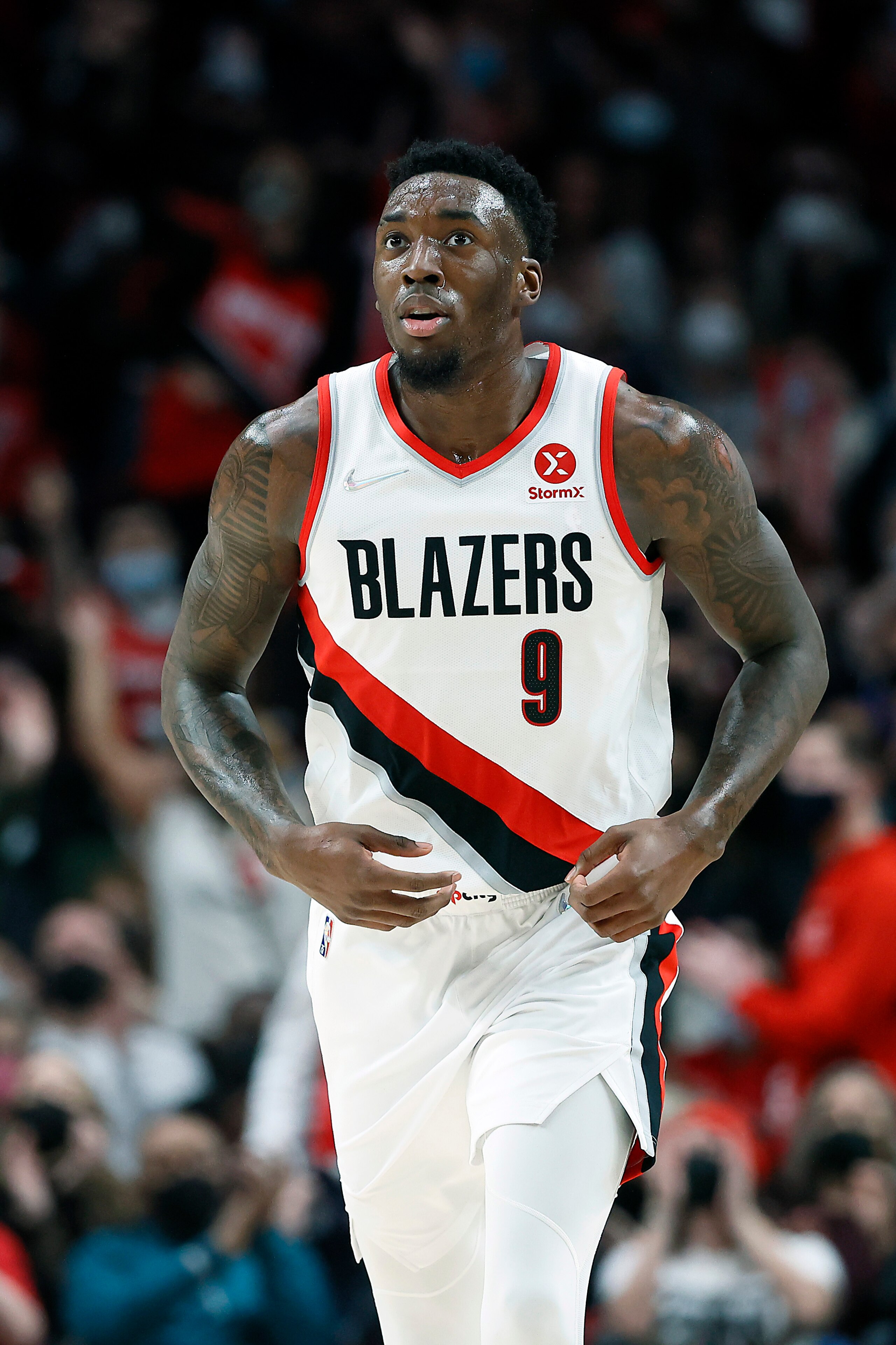 PORTLAND, OREGON - JANUARY 07: Nassir Little # 9 of the Portland Trail Blazers looks on during the second half at Moda Center on January 07, 2022 in Portland, Oregon. NOTE TO USER: User expressly acknowledges and agrees that, by downloading and or using this photograph, User is consenting to the terms and conditions of the Getty Images License Agreement.  (Photo by Soobum Im/Getty Images)