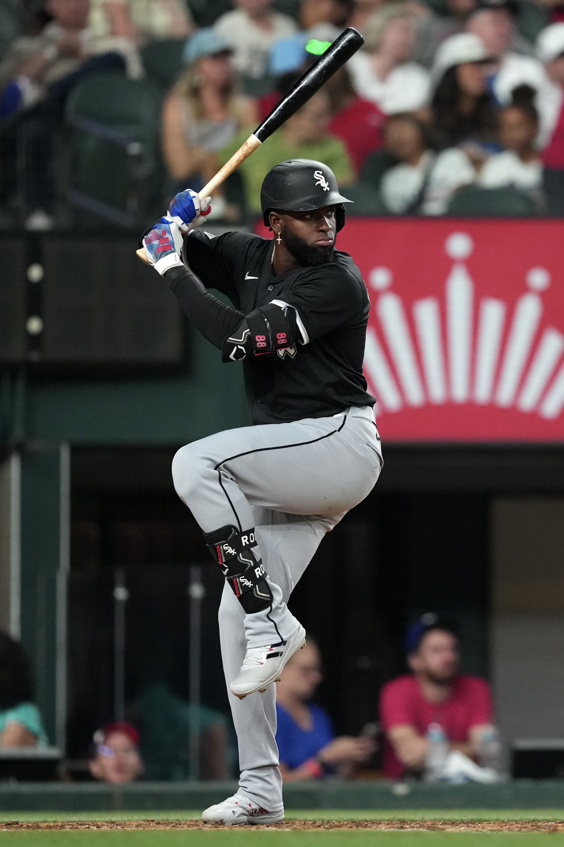 ARLINGTON, TEXAS - JULY 23: Luis Robert Jr. #88 of the Chicago White Sox swings his bat during the fifth inning against the Texas Rangers at Globe Life Field on July 23, 2024 in Arlington, Texas. (Photo by Sam Hodde/Getty Images)