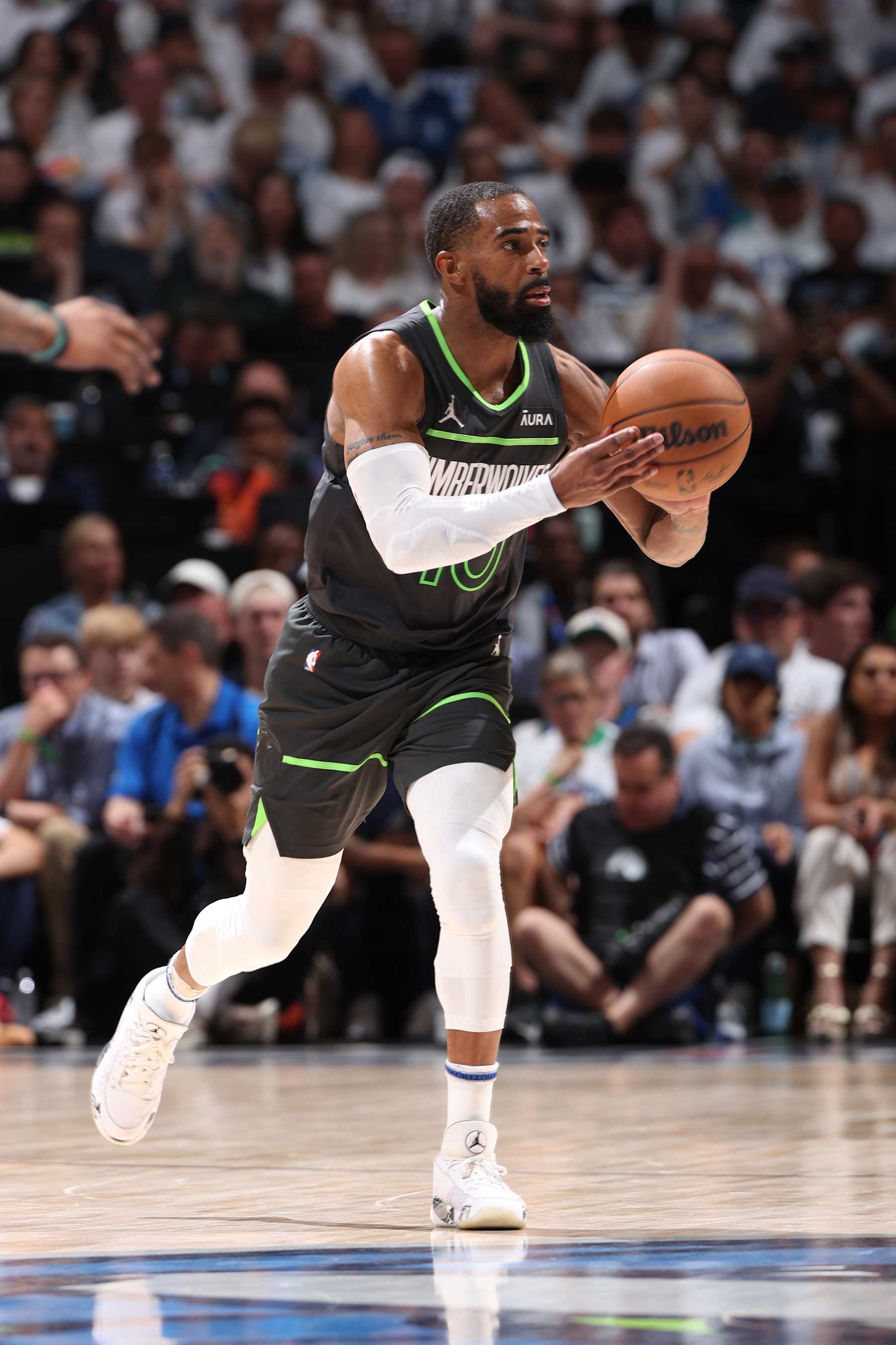 MINNEAPOLIS, MN - MAY 30: Mike Conley #10 of the Minnesota Timberwolves passes the ball during the game against the Dallas Mavericks during Round 3 Game 5 of the 2024 NBA Playoffs on May 30, 2024 at Target Center in Minneapolis, Minnesota. NOTE TO USER: User expressly acknowledges and agrees that, by downloading and or using this Photograph, user is consenting to the terms and conditions of the Getty Images License Agreement. Mandatory Copyright Notice: Copyright 2024 NBAE (Photo by Joe Murphy/NBAE via Getty Images)