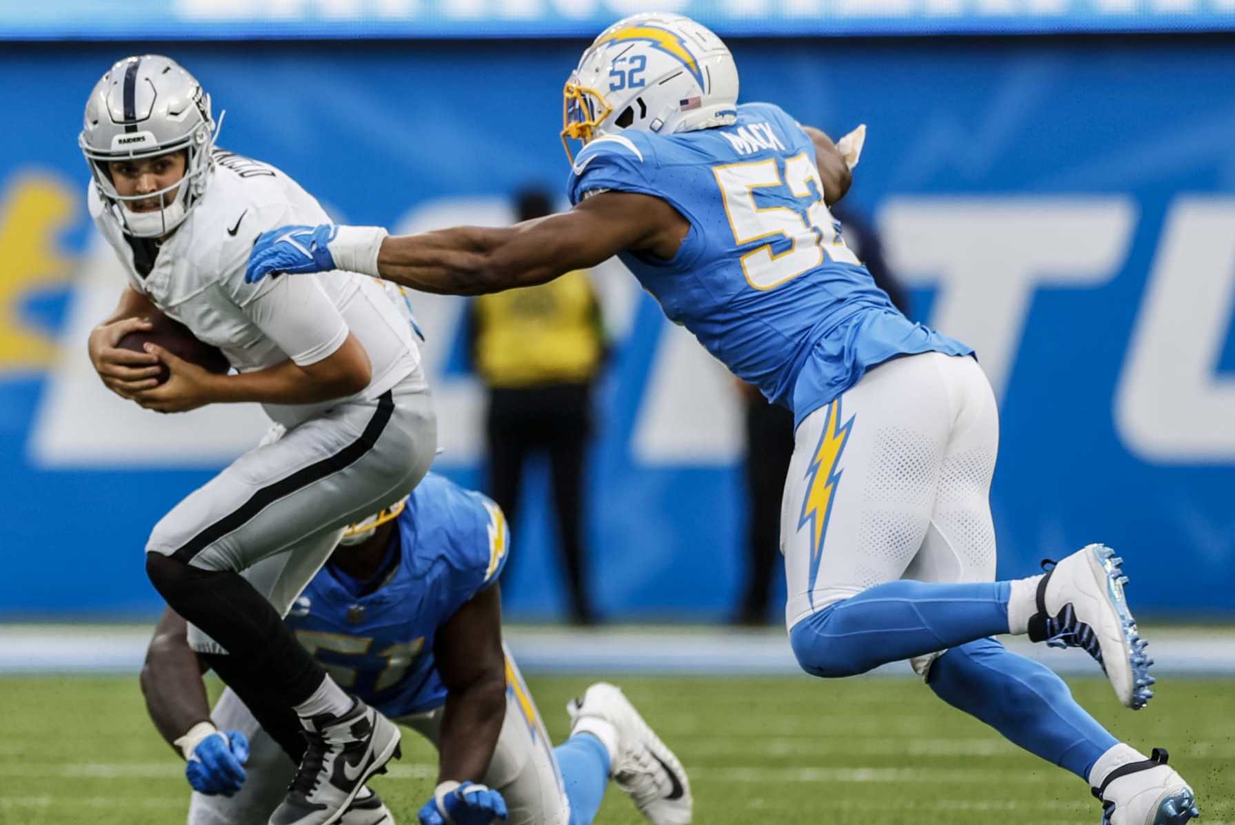 Inglewood, CA, Sunday, October 1, 2023 - Los Angeles Chargers linebacker Khalil Mack (52) closes in for a second half sack of Las Vegas Raiders quarterback Aidan O'Connell (4) at SoFi Stadium. (Robert Gauthier/Los Angeles Times via Getty Images)
