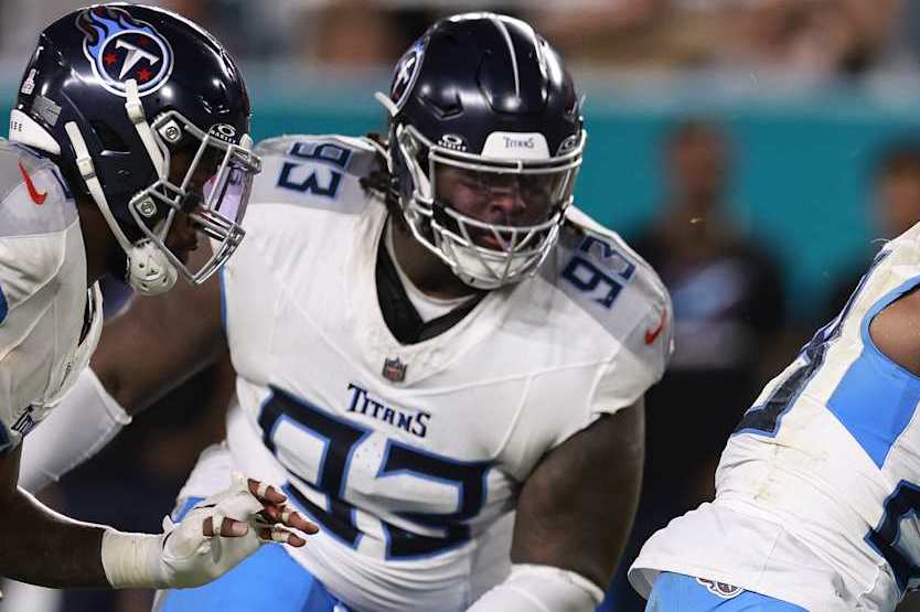 MIAMI GARDENS, FLORIDA - SEPTEMBER 30: Tyreek Hill #10 of the Miami Dolphins is tackled by Quandre Diggs #28 of the Tennessee Titans during the second quarter at Hard Rock Stadium on September 30, 2024 in Miami Gardens, Florida. (Photo by Carmen Mandato/Getty Images)