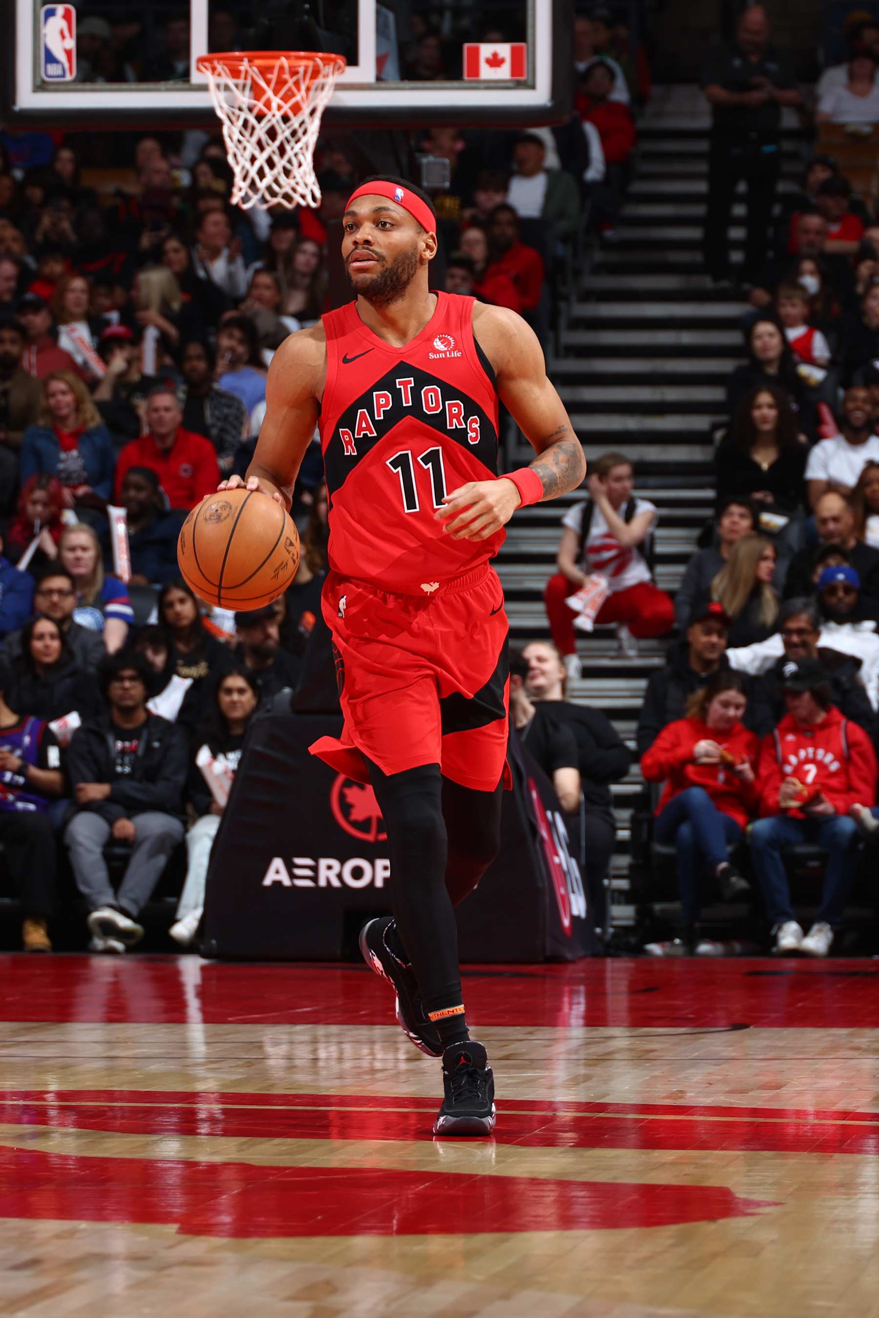 TORONTO, CANADA - MARCH 31: Bruce Brown #11 of the Toronto Raptors dribbles the ball during the game against the Philadelphia 76ers on March 31, 2024 at the Scotiabank Arena in Toronto, Ontario, Canada.  NOTE TO USER: User expressly acknowledges and agrees that, by downloading and or using this Photograph, user is consenting to the terms and conditions of the Getty Images License Agreement.  Mandatory Copyright Notice: Copyright 2024 NBAE (Photo by Vaughn Ridley/NBAE via Getty Images)