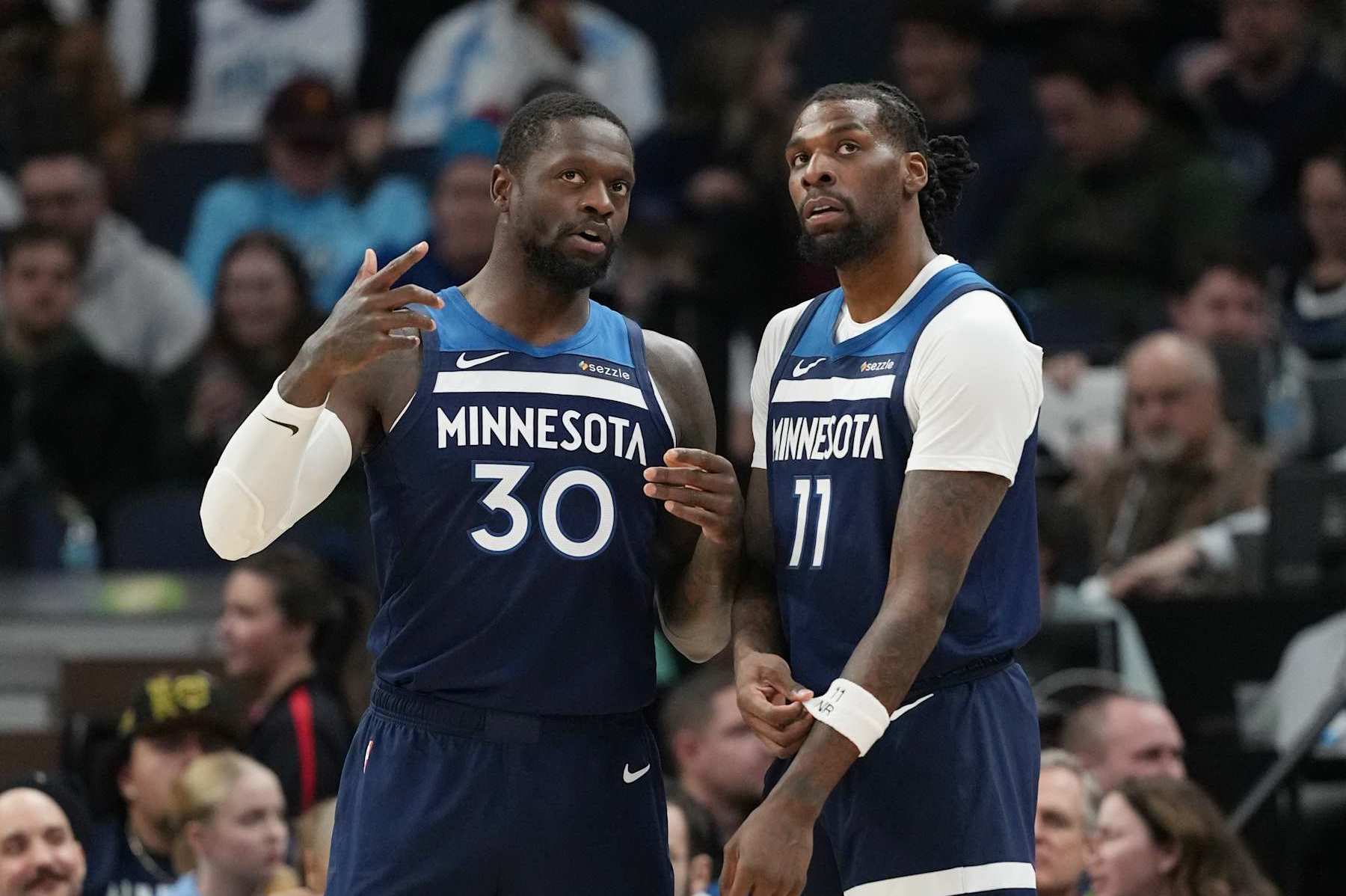MINNEAPOLIS, MN - DECEMBER 13: Julius Randle #30 and Naz Reid #11 of the Minnesota Timberwolves look on during the game against the Los Angeles Lakers on December 13, 2024 at Target Center in Minneapolis, Minnesota. NOTE TO USER: User expressly acknowledges and agrees that, by downloading and or using this Photograph, user is consenting to the terms and conditions of the Getty Images License Agreement. Mandatory Copyright Notice: Copyright 2024 NBAE (Photo by Jordan Johnson/NBAE via Getty Images)