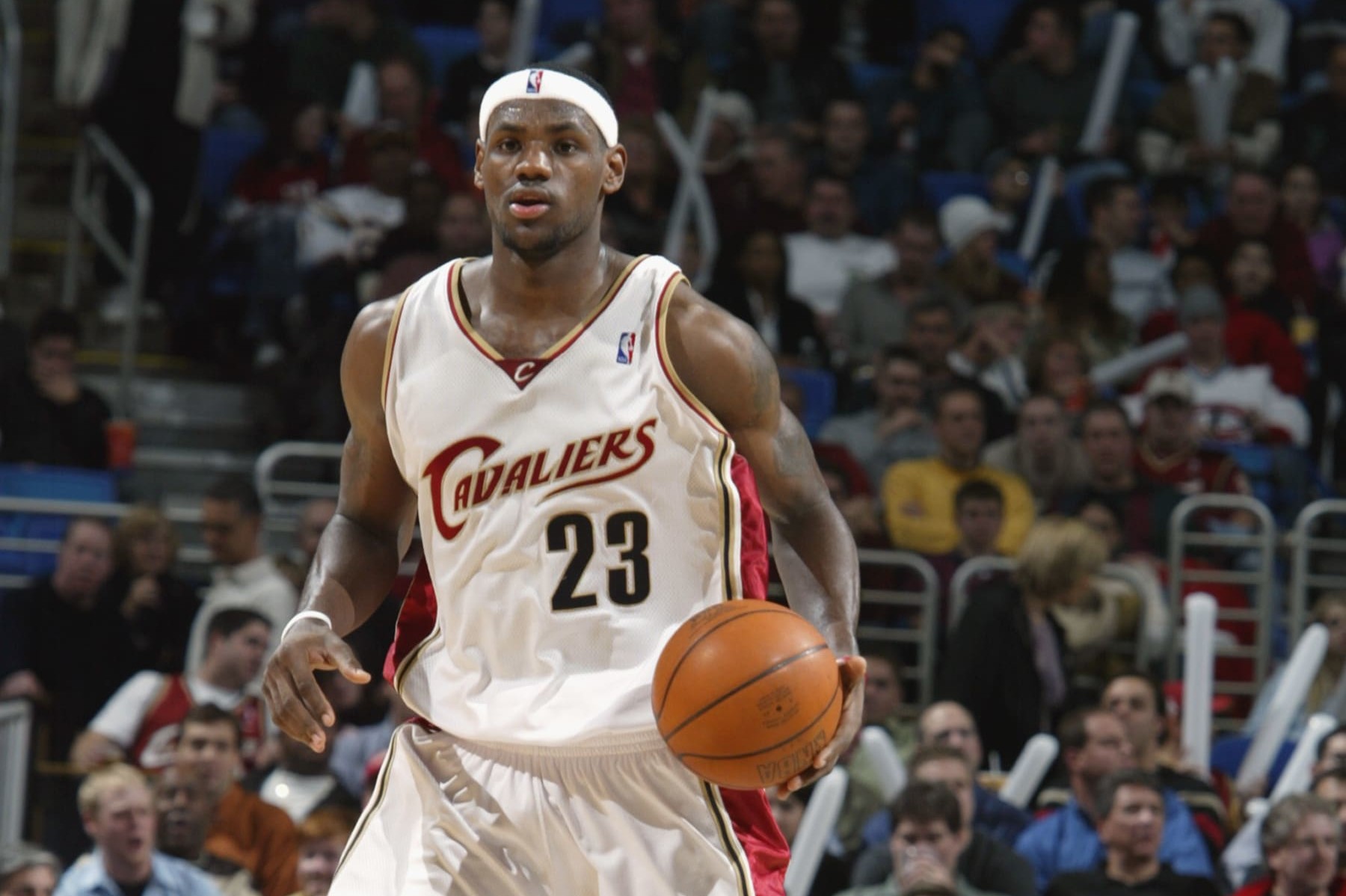 CLEVELAND - DECEMBER 23:  LeBron James #23 of the Cleveland Cavaliers moves the ball up court during the game against the New Orleans Hornets at Gund Arena on December 23, 2003 in Cleveland, Ohio.  The Cavaliers won 97-86.  NOTE TO USER: User expressly acknowledges and agrees that, by downloading and/or using this Photograph, User is consenting to the terms and conditions of the Getty Images License Agreement (Photo by David Liam Kyle/NBAE via Getty Images) 