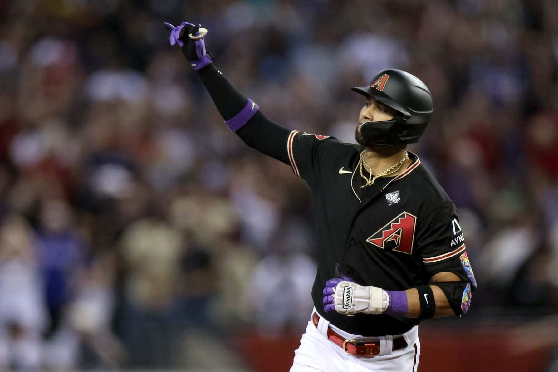 PHOENIX, ARIZONA - OCTOBER 31: Lourdes Gurriel Jr. #12 of the Arizona Diamondbacks rounds the bases after hitting a home run in the eighth inning against the Texas Rangers during Game Four of the World Series at Chase Field on October 31, 2023 in Phoenix, Arizona. (Photo by Harry How/Getty Images)