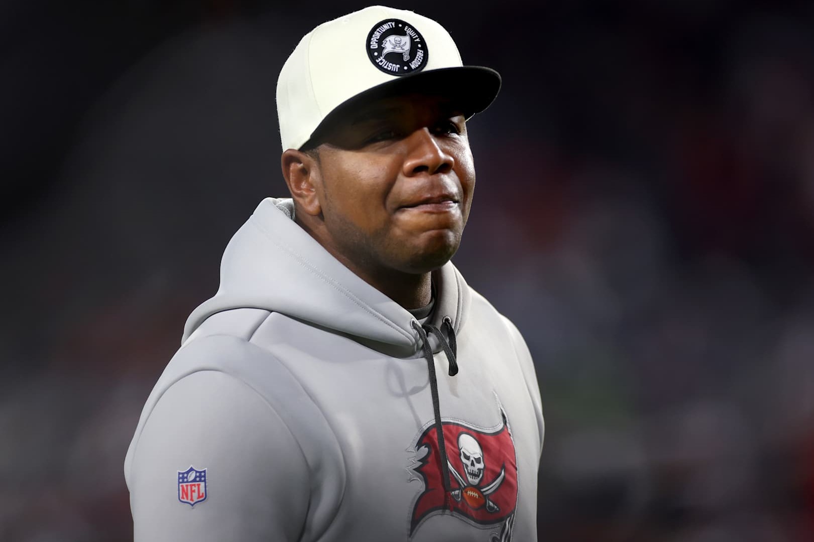 TAMPA, FLORIDA - JANUARY 16:  Offensive Coordinator Byron Leftwich of the Tampa Bay Buccaneers looks on prior to the game against the Dallas Cowboys in the NFC Wild Card playoff game at Raymond James Stadium on January 16, 2023 in Tampa, Florida. (Photo by Mike Ehrmann/Getty Images)