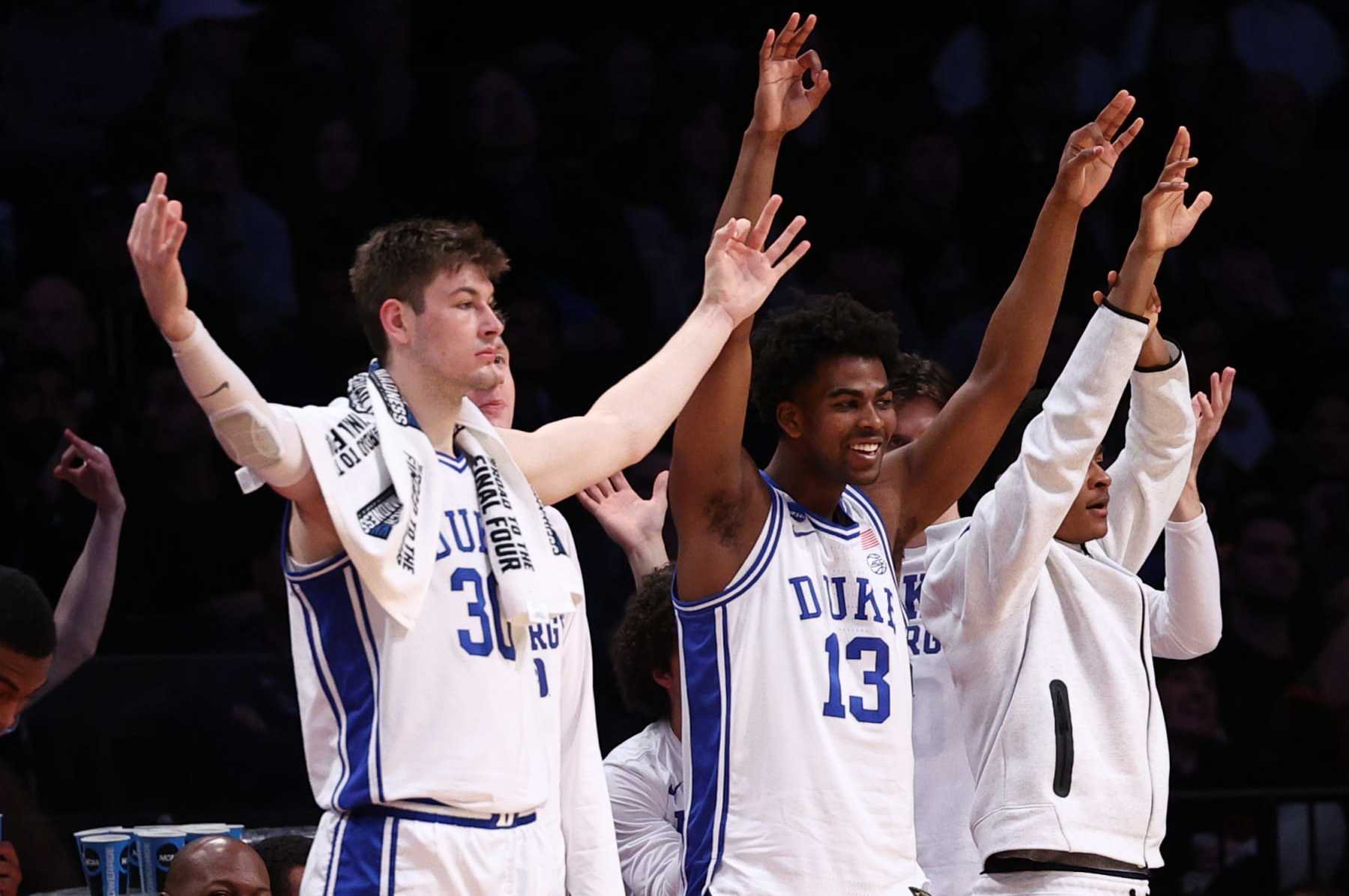 NEW YORK, NEW YORK - MARCH 24: Kyle Filipowski #30 and Sean Stewart #13 of the Duke Blue Devils react on the bench during the first half against the James Madison Dukes in the second round of the NCAA Men's Basketball Tournament at Barclays Center on March 24, 2024 in New York City. (Photo by Elsa/Getty Images)