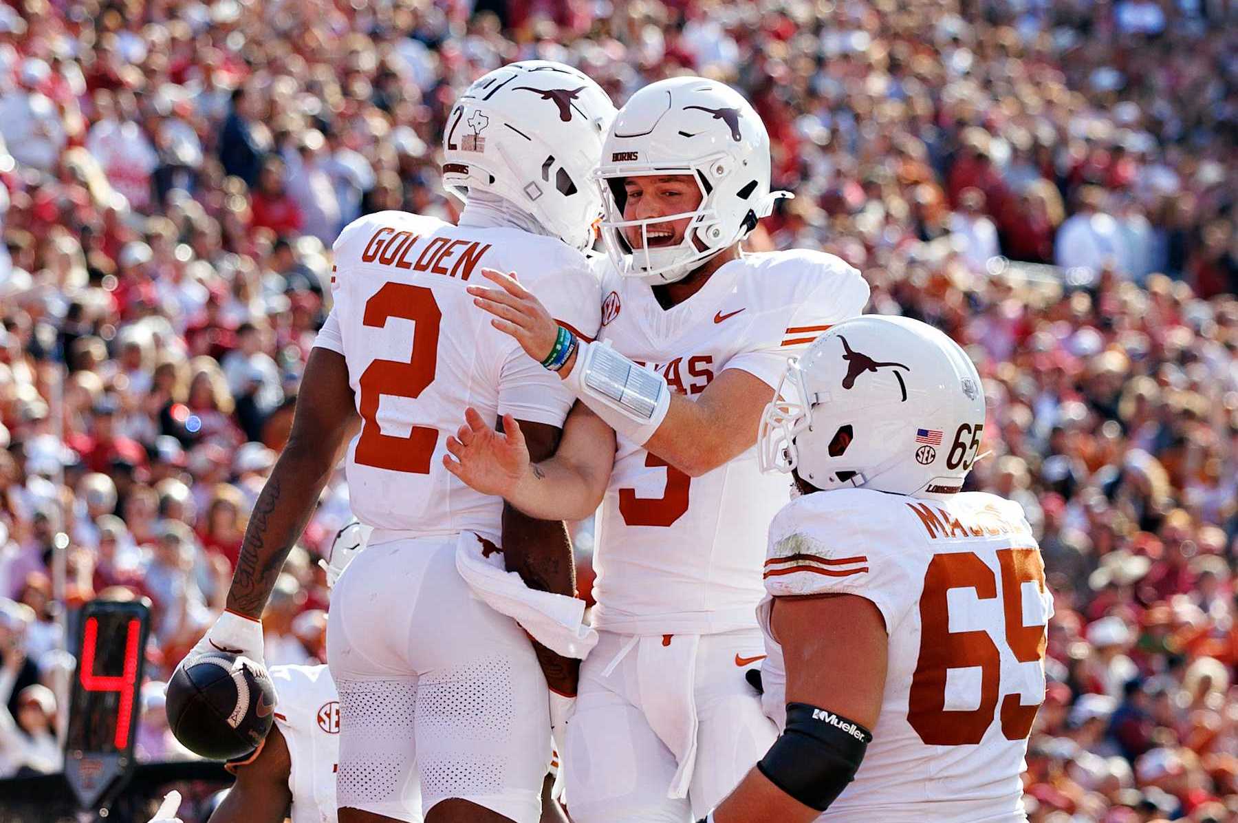 FAYETTEVILLE, ARKANSAS - NOVEMBER 16: Quinn Ewers #3 and Matthew Golden #2 of the Texas Longhorns celebrate after a touchdown in the first half during a game against the Arkansas Razorbacks at Donald W. Reynolds Razorback Stadium on November 16, 2024 in Fayetteville, Arkansas. (Photo by Wesley Hitt/Getty Images)