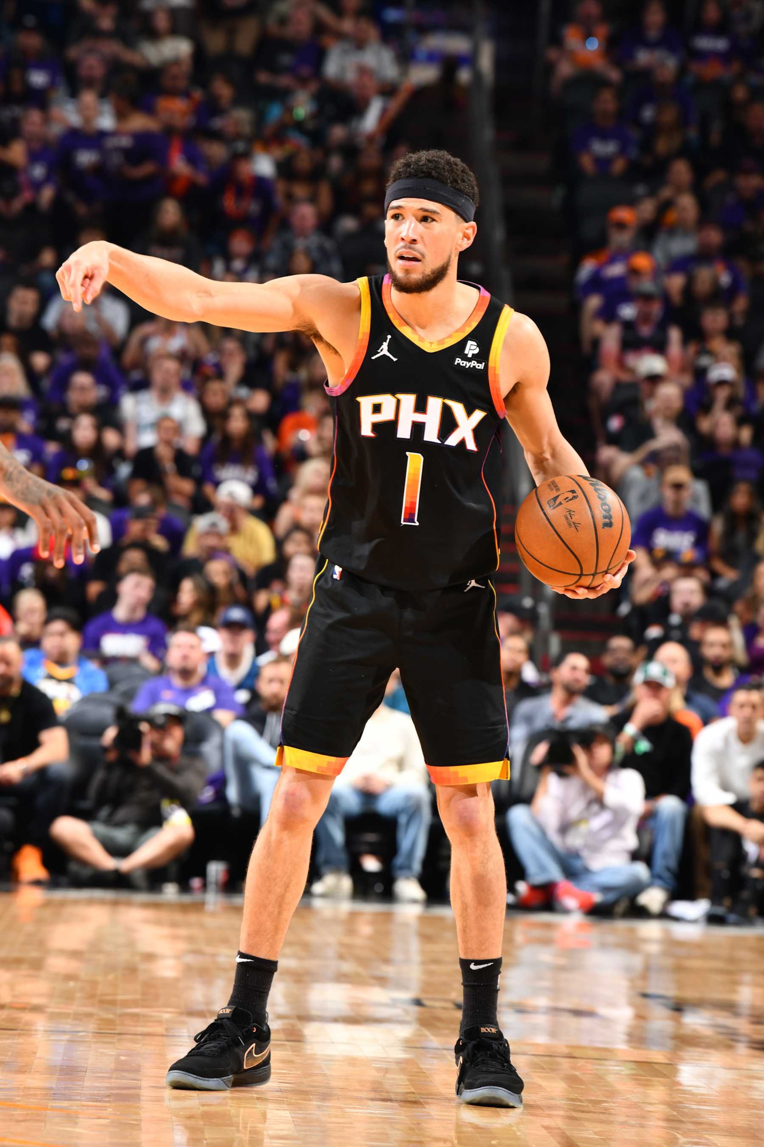 PHOENIX, AZ - APRIL 4: Devin Booker #1 of the Phoenix Suns handles the ball during the game against the Minnesota Timberwolves during Round 1 Game 4 of the 2024 NBA Playoffs on April 4, 2023 at Footprint Center in Phoenix, Arizona. NOTE TO USER: User expressly acknowledges and agrees that, by downloading and or using this photograph, user is consenting to the terms and conditions of the Getty Images License Agreement. Mandatory Copyright Notice: Copyright 2024 NBAE (Photo by Barry Gossage/NBAE via Getty Images)