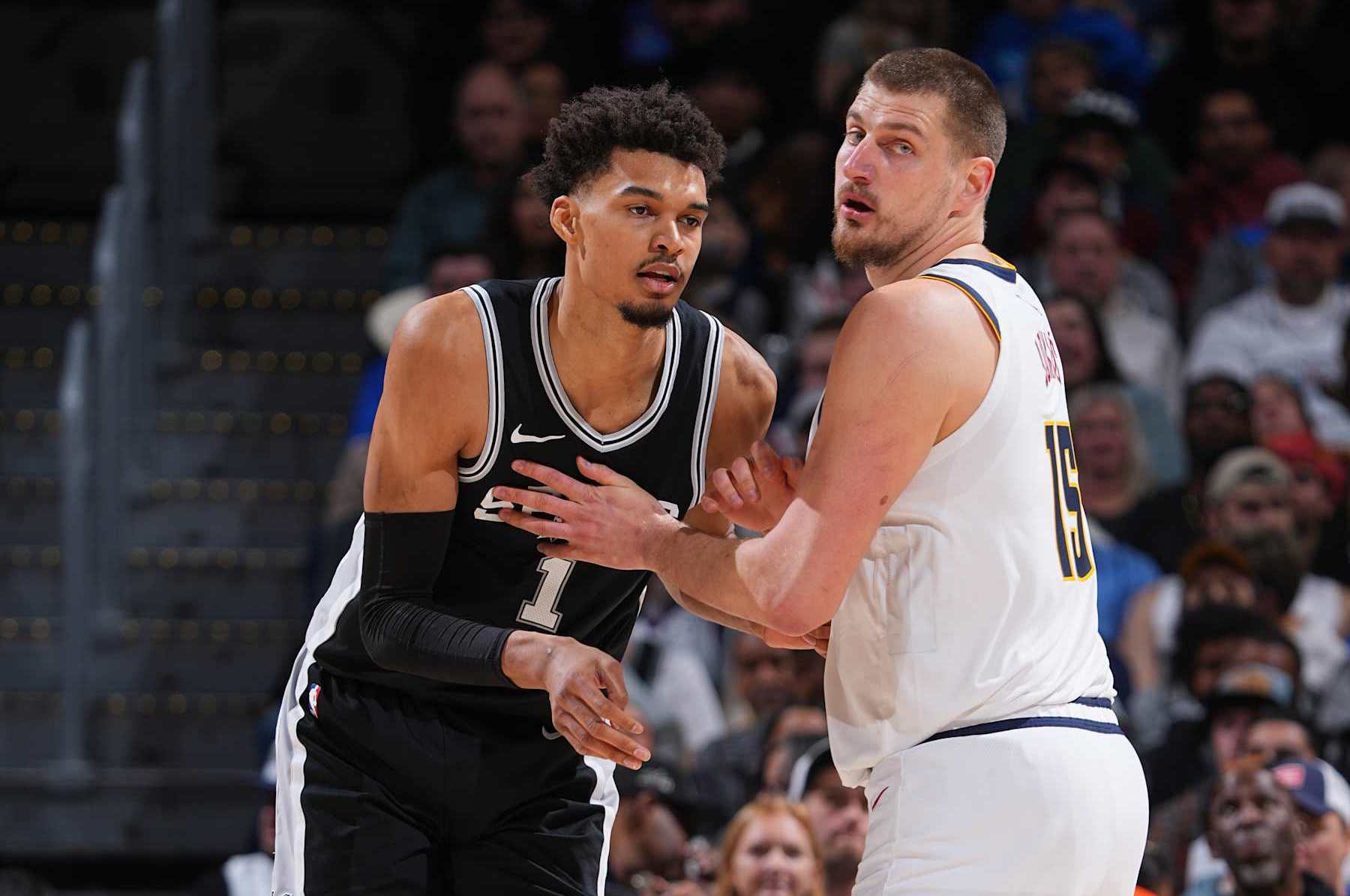DENVER, CO - JANUARY 3: Nikola Jokic #15 of the Denver Nuggets and Victor Wembanyama #1 of the San Antonio Spurs battle for position during the game on January 3, 2025 at Ball Arena in Denver, Colorado. NOTE TO USER: User expressly acknowledges and agrees that, by downloading and/or using this Photograph, user is consenting to the terms and conditions of the Getty Images License Agreement. Mandatory Copyright Notice: Copyright 2025 NBAE (Photo by Garrett Ellwood/NBAE via Getty Images)