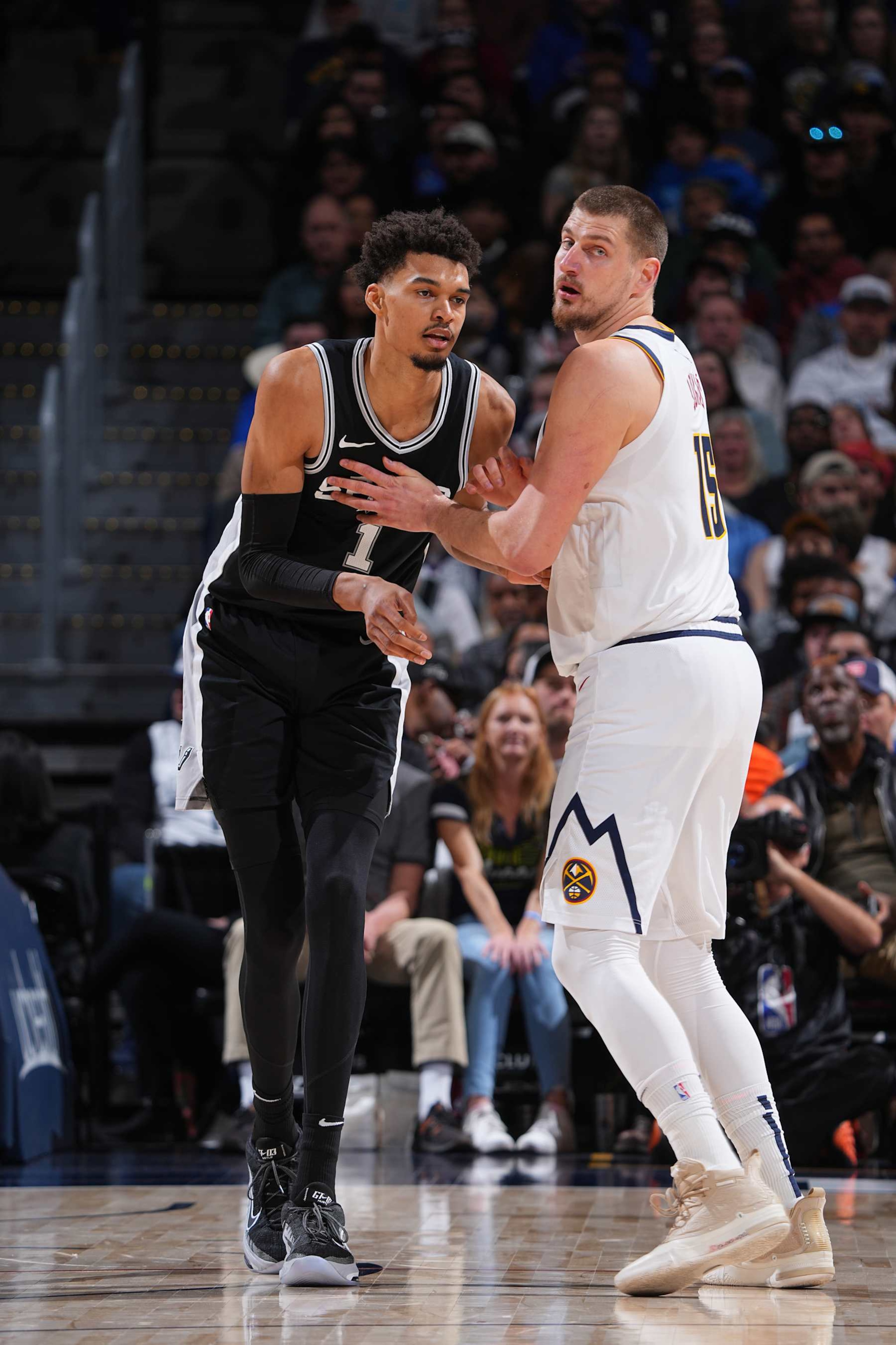DENVER, CO - JANUARY 3: Nikola Jokic #15 of the Denver Nuggets and Victor Wembanyama #1 of the San Antonio Spurs battle for position during the game on January 3, 2025 at Ball Arena in Denver, Colorado. NOTE TO USER: User expressly acknowledges and agrees that, by downloading and/or using this Photograph, user is consenting to the terms and conditions of the Getty Images License Agreement. Mandatory Copyright Notice: Copyright 2025 NBAE (Photo by Garrett Ellwood/NBAE via Getty Images) DENVER, CO - JANUARY 3: Nikola Jokic #15 of the Denver Nuggets and Victor Wembanyama #1 of the San Antonio Spurs battle for position during the game on January 3, 2025 at Ball Arena in Denver, Colorado. NOTE TO USER: User expressly acknowledges and agrees that, by downloading and/or using this Photograph, user is consenting to the terms and conditions of the Getty Images License Agreement. Mandatory Copyright Notice: Copyright 2025 NBAE (Photo by Garrett Ellwood/NBAE via Getty Images)