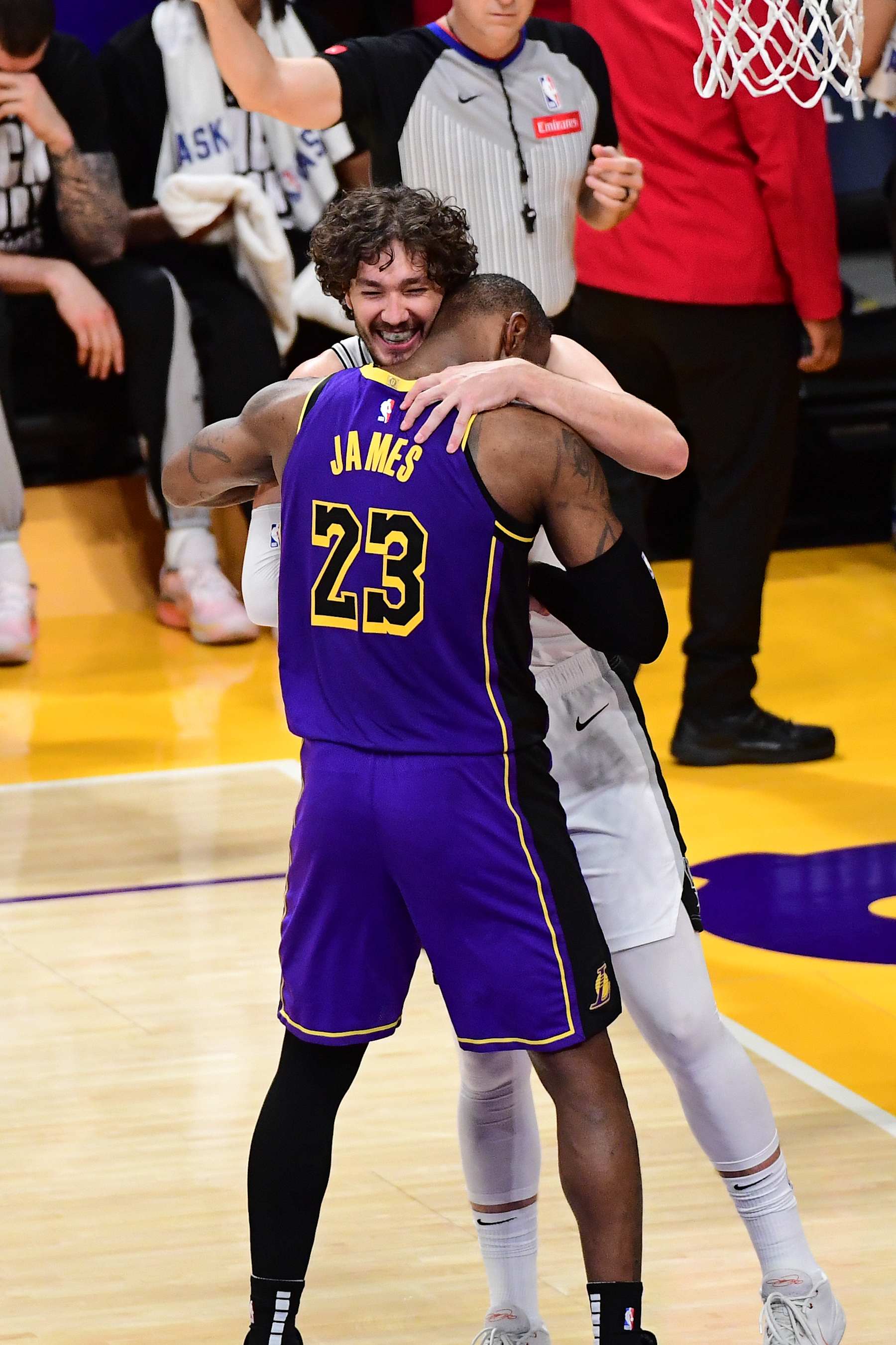 LOS ANGELES, CA - FEBRUARY 23: Cedi Osman #16 of the San Antonio Spurs hugs LeBron James #23 of the Los Angeles Lakers during the game on February 23, 2024 at Crypto.Com Arena in Los Angeles, California. NOTE TO USER: User expressly acknowledges and agrees that, by downloading and/or using this Photograph, user is consenting to the terms and conditions of the Getty Images License Agreement. Mandatory Copyright Notice: Copyright 2024 NBAE (Photo by Adam Pantozzi/NBAE via Getty Images)