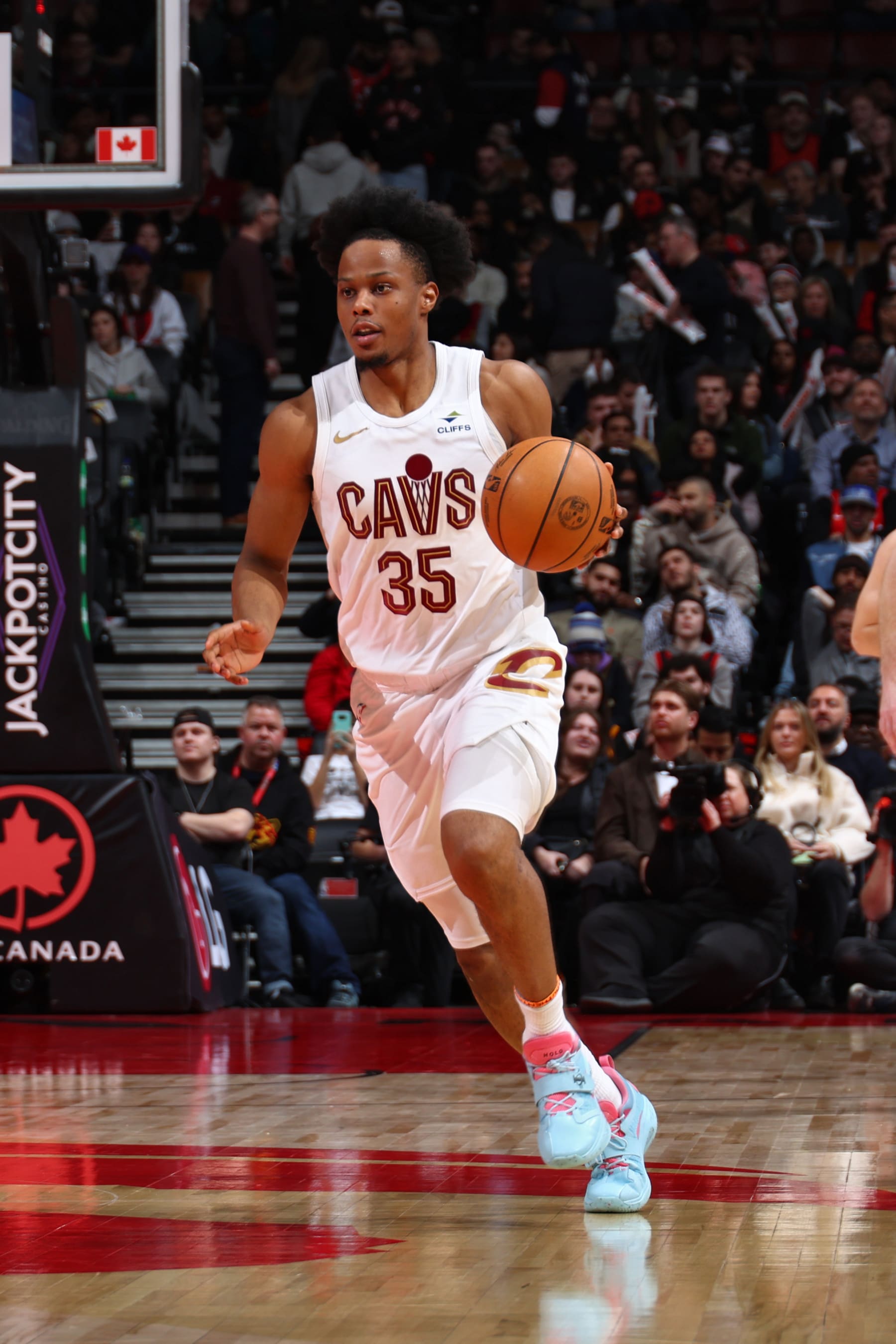 TORONTO, CANADA - FEBRUARY 10: Isaac Okoro #35 of the Cleveland Cavaliers dribbles the ball during the game against the Toronto Raptors on February 10, 2024 at the Scotiabank Arena in Toronto, Ontario, Canada.  NOTE TO USER: User expressly acknowledges and agrees that, by downloading and or using this Photograph, user is consenting to the terms and conditions of the Getty Images License Agreement.  Mandatory Copyright Notice: Copyright 2024 NBAE (Photo by Vaughn Ridley/NBAE via Getty Images)