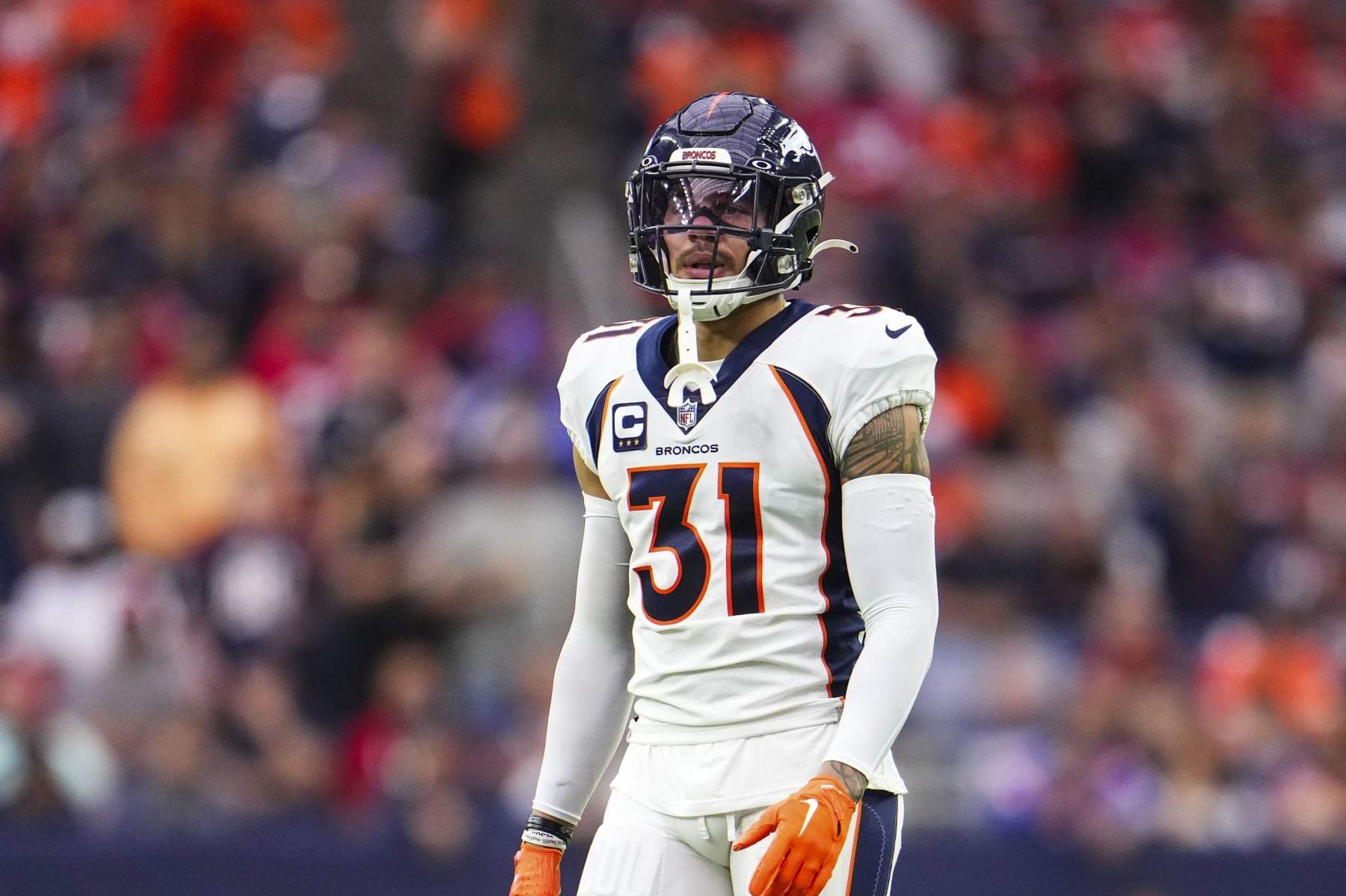 HOUSTON, TX - DECEMBER 03: Justin Simmons #31 of the Denver Broncos looks on from the field during an NFL football game against the Houston Texans at NRG Stadium on December 3, 2023 in Houston, Texas. (Photo by Cooper Neill/Getty Images)