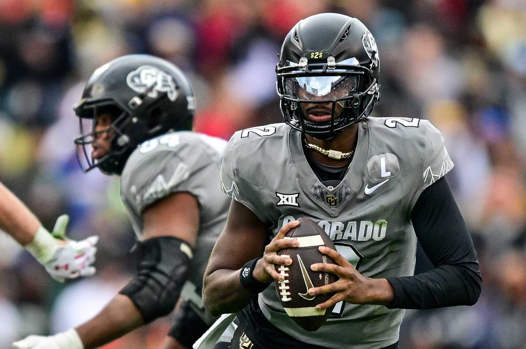 BOULDER, CO - NOVEMBER 16:  Shedeur Sanders #2 of the Colorado Buffaloes looks for a target in the fourth quarter against the Utah Utes at Folsom Field on November 16, 2024 in Boulder, Colorado. (Photo by Dustin Bradford/Getty Images)