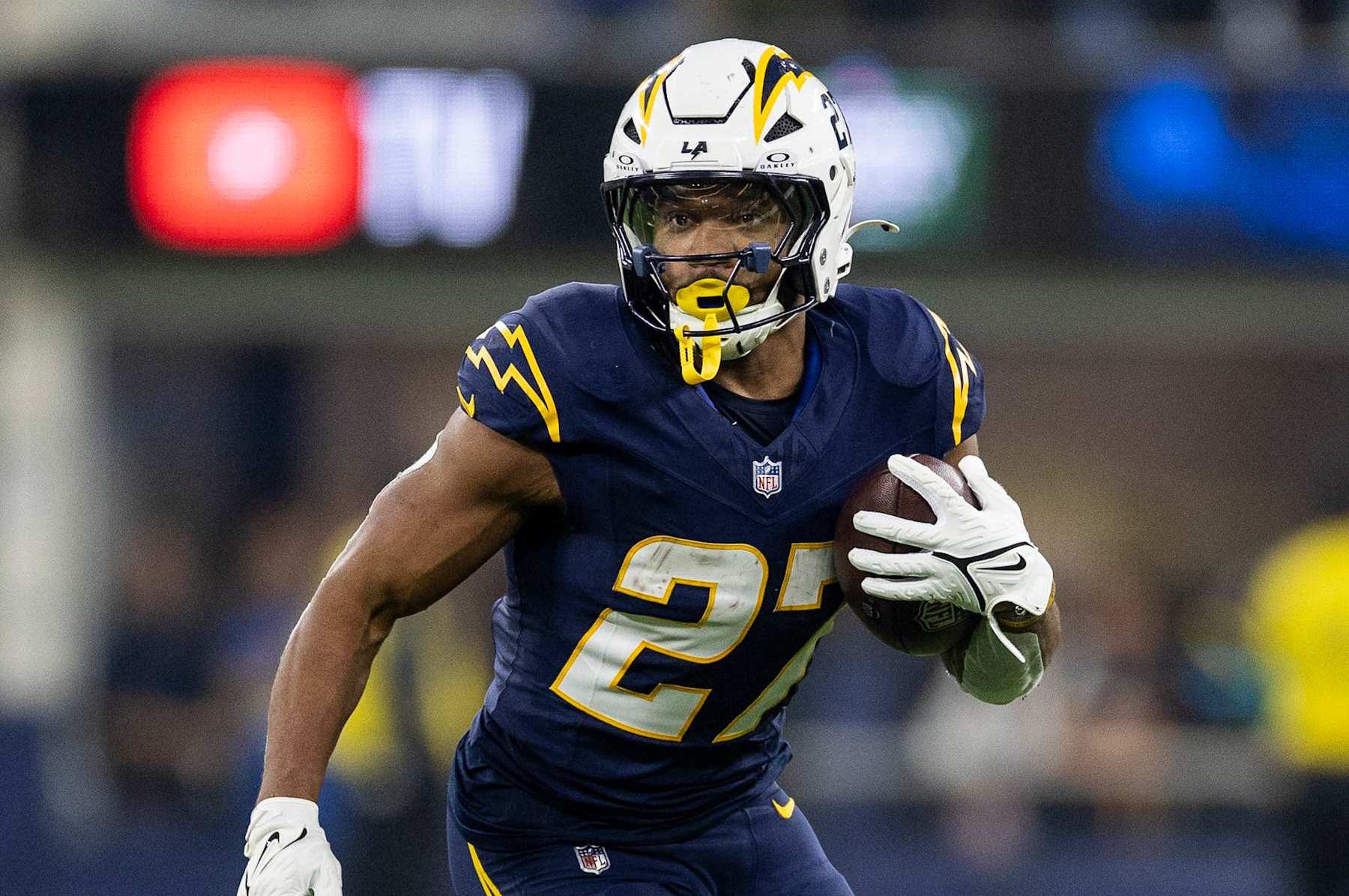 INGLEWOOD, CALIFORINA - NOVEMBER 25: J.K. Dobbins #27 of the Los Angeles Chargers runs with the ball during an NFL Football game against the Baltimore Ravens at SoFi Stadium on November 25, 2024 in Inglewood, Califorina. (Photo by Michael Owens/Getty Images)