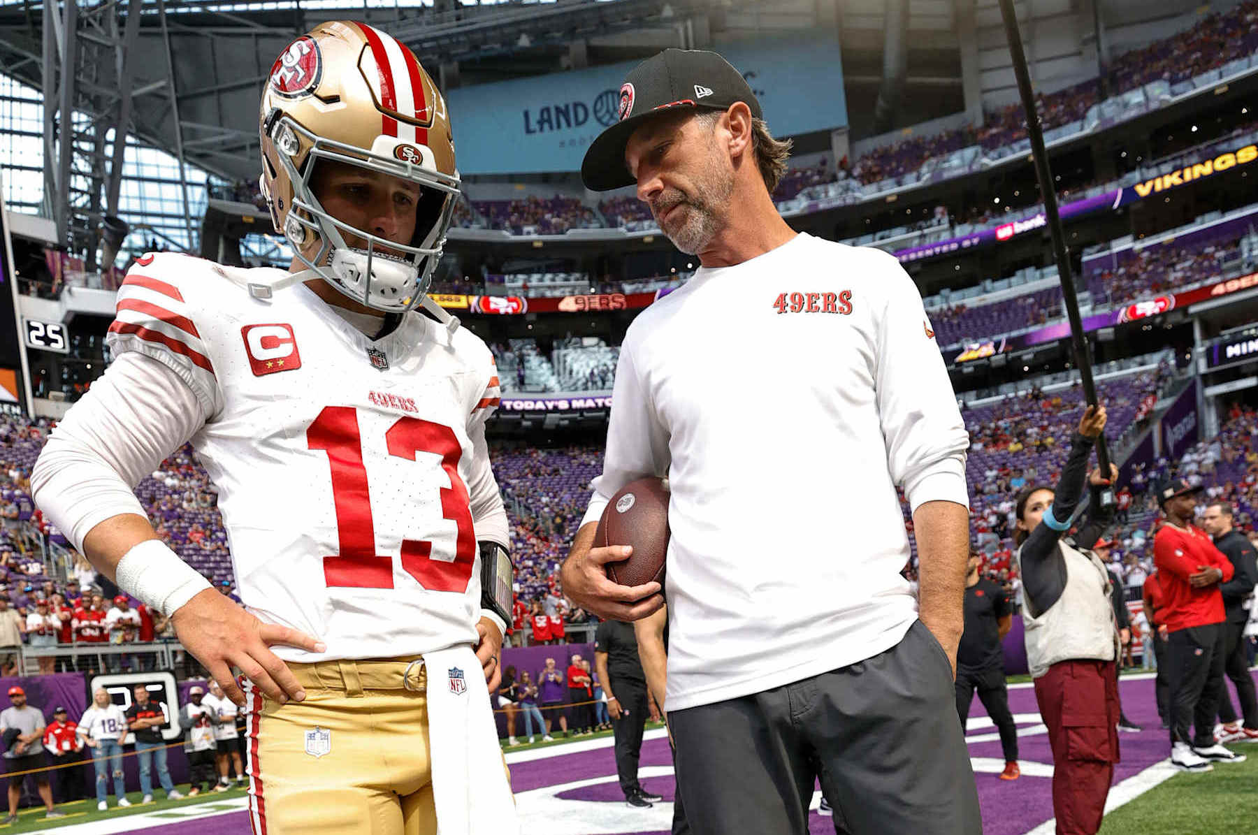 MINNEAPOLIS, MN - SEPTEMBER 15: Brock Purdy #13 and Head Coach Kyle Shanahan of the San Francisco 49ers before the game against the Minnesota Vikings at U.S. Bank Stadium on September 15, 2024 in Minneapolis, Minnesota. The Vikings defeated the 49ers 23-17. (Photo by Michael Zagaris/San Francisco 49ers/Getty Images)