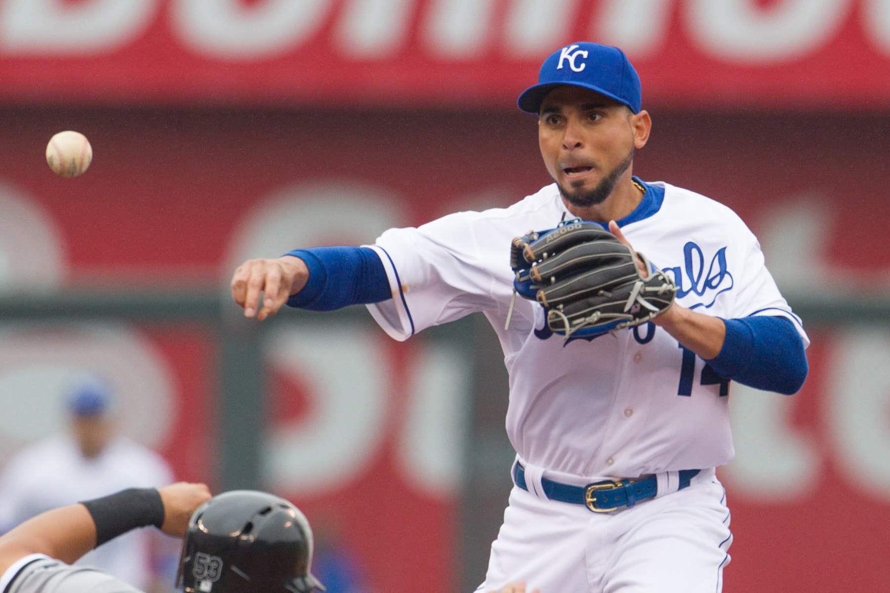 April 6, 2014: Kansas City Royals second baseman Omar Infante (14) throws to first over Chicago White Sox left fielder Melky Cabrera (53) during the MLB American League opening day game between the Chicago White Sox and the Kansas City Royals at Kauffman Stadium in Kansas City, Kansas (Photo by William Purnell/Icon Sportswire/Corbis/Icon Sportswire via Getty Images)