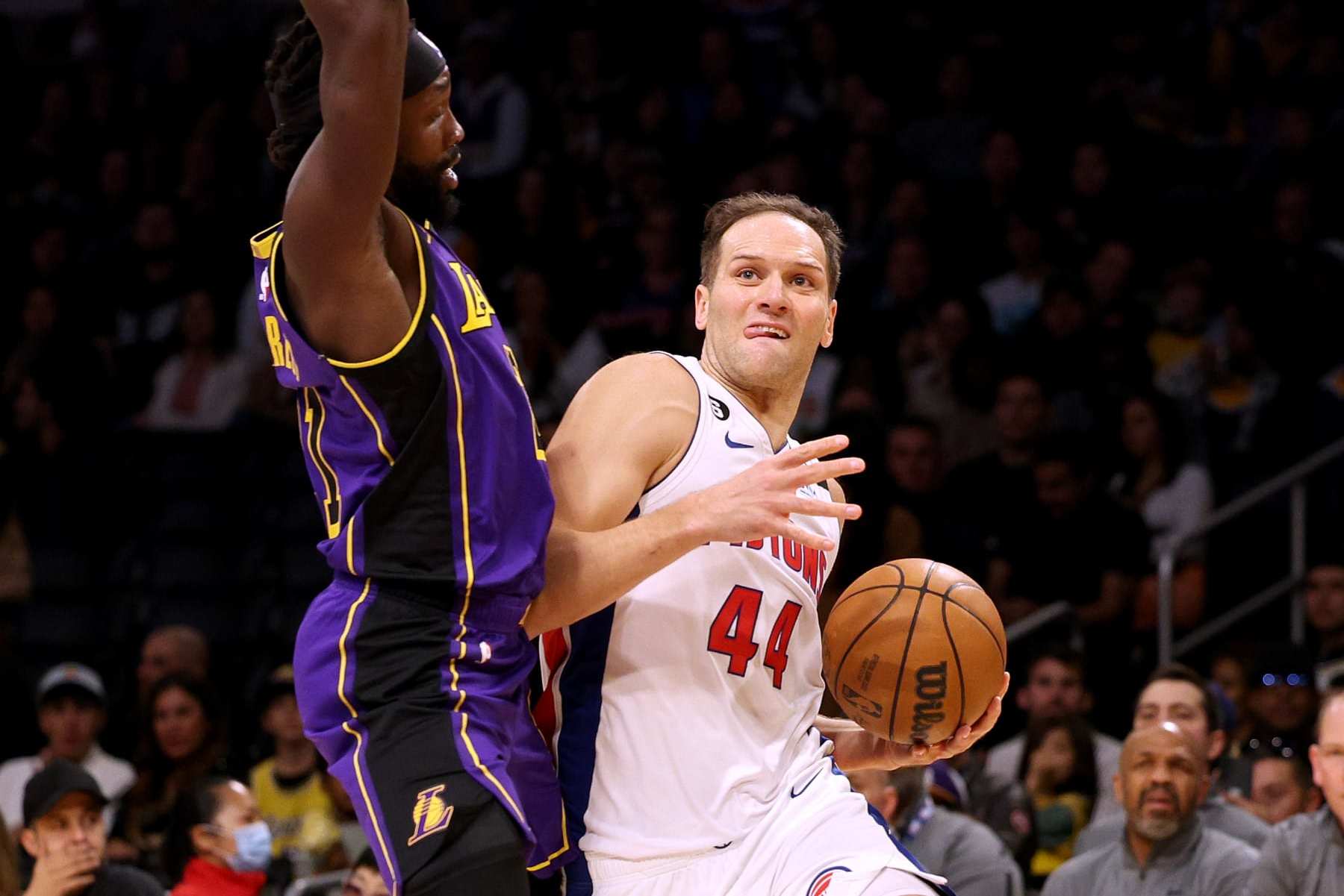 LOS ANGELES, CALIFORNIA - NOVEMBER 18: Bojan Bogdanovic #44 of the Detroit Pistons reacts as he is fouled by Patrick Beverley #21 of the Los Angeles Lakers during the first half at Crypto.com Arena on November 18, 2022 in Los Angeles, California. NOTE TO USER: User expressly acknowledges and agrees that by downloading and/or using this Photograph, user is consenting to the terms and conditions of the Getty Images License Agreement. Mandatory Copyright Notice: Copyright 2022 NBAE. (Photo by Harry How/Getty Images)