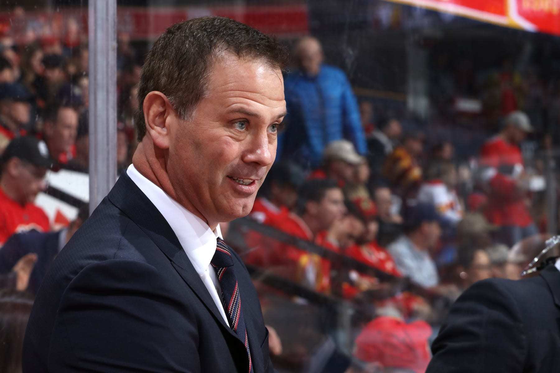 CALGARY, ALBERTA - NOVEMBER 30: Assistant coach Craig Conroy of the Calgary Flames watches against the Ottawa Senators at Scotiabank Saddledome on November 30, 2019 in Calgary, Canada. (Photo by Gerry Thomas/NHLI via Getty Images)